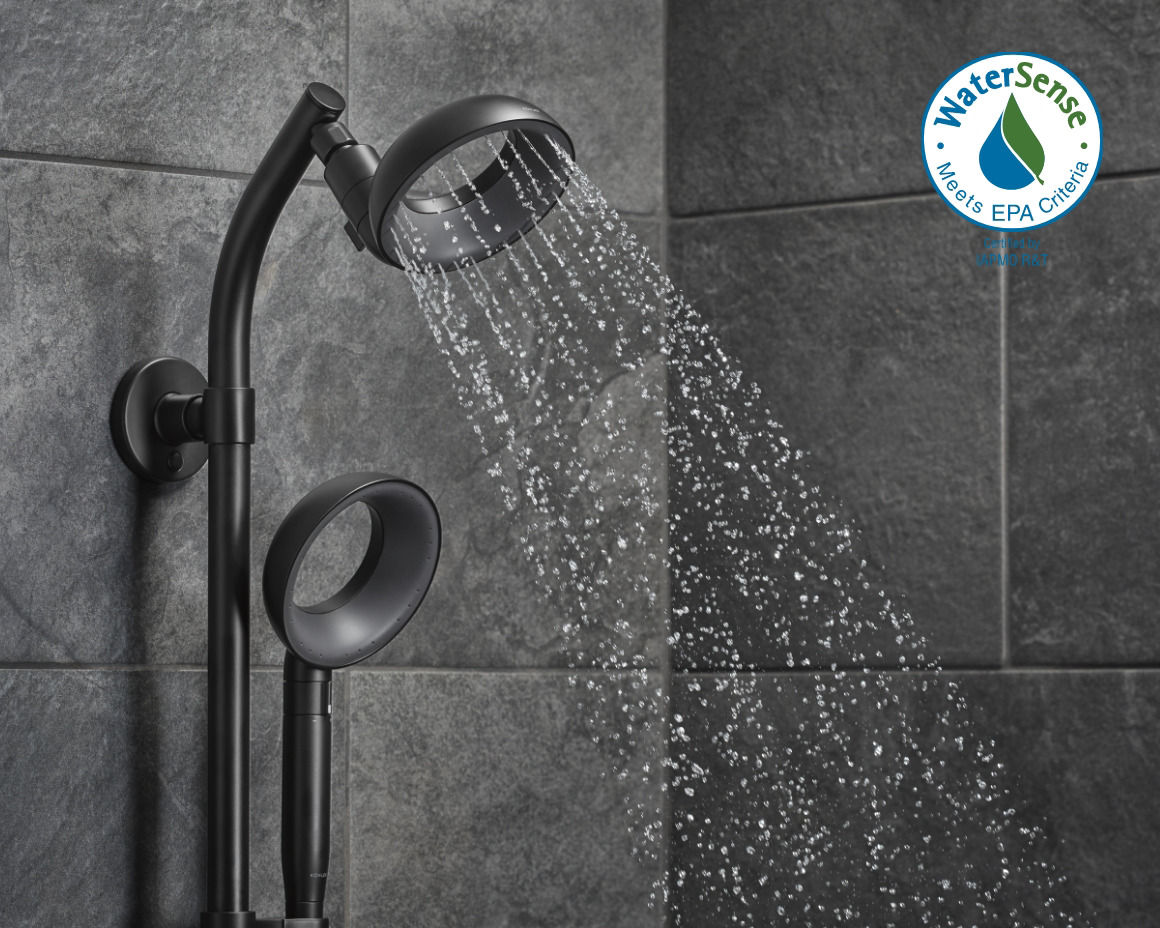 Matte black showerhead emitting water in a tiled bathroom, highlighting Kohler's WaterSense-certified products.