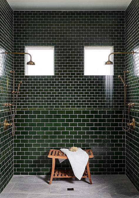 Modern bathroom shower interior with Ann Sacks dark green shower tile.