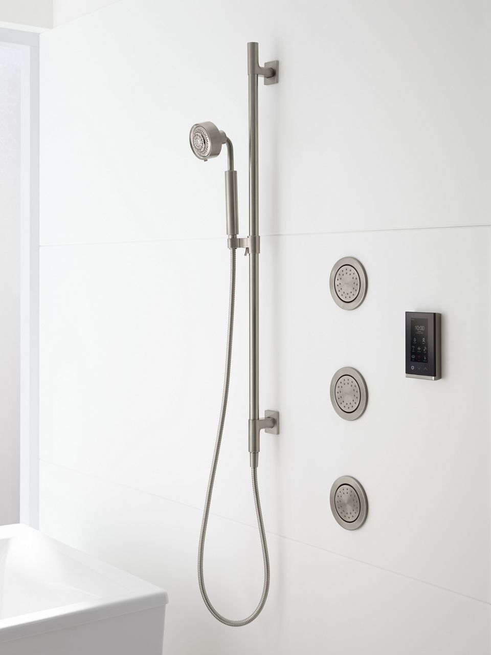 A moodboard featuring items that add sparkle and add dimension to a white-on-white bathroom