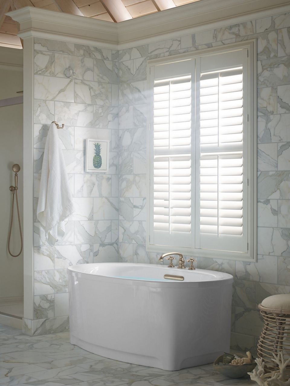 A moodboard featuring items that add sparkle and add dimension to a white-on-white bathroom