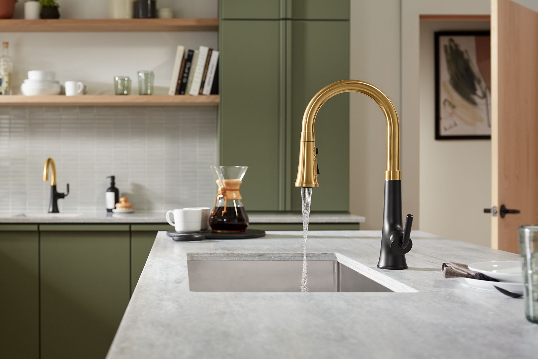 A Tone faucet in two tone matte black and brushed moderne brass