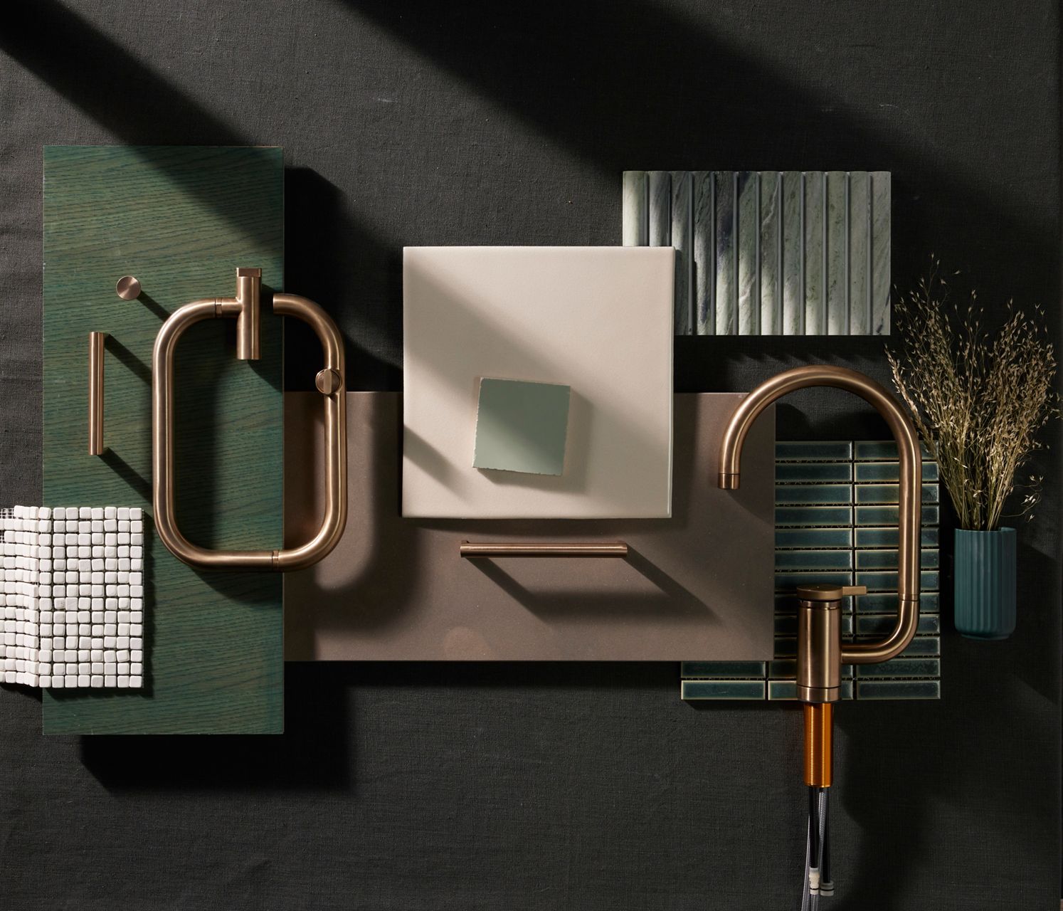 Brushed brass faucet with ribbed glass and textured wall panel