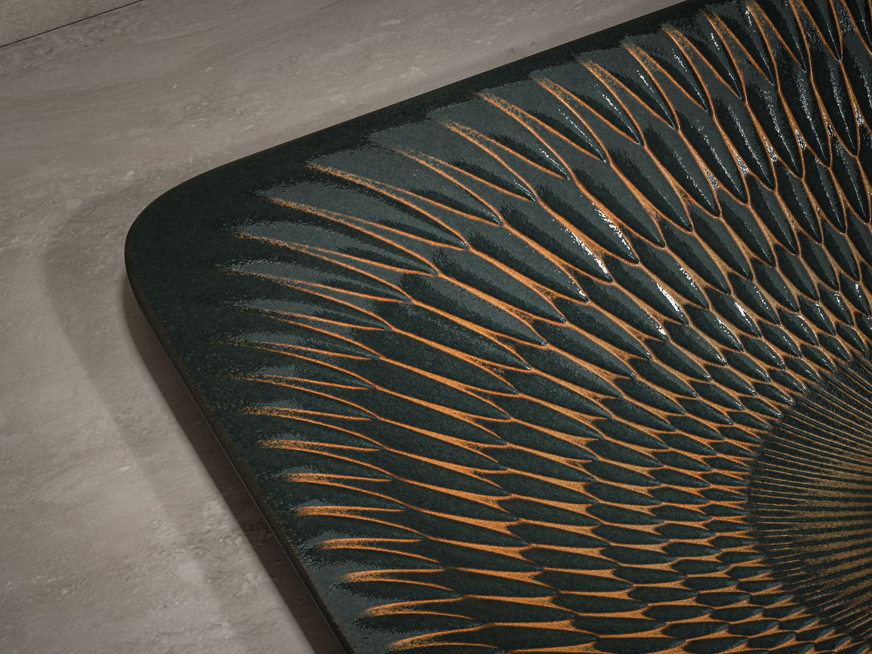 Close up view of a decorative modern ceramic vessel with dark teal and gold texture detail.