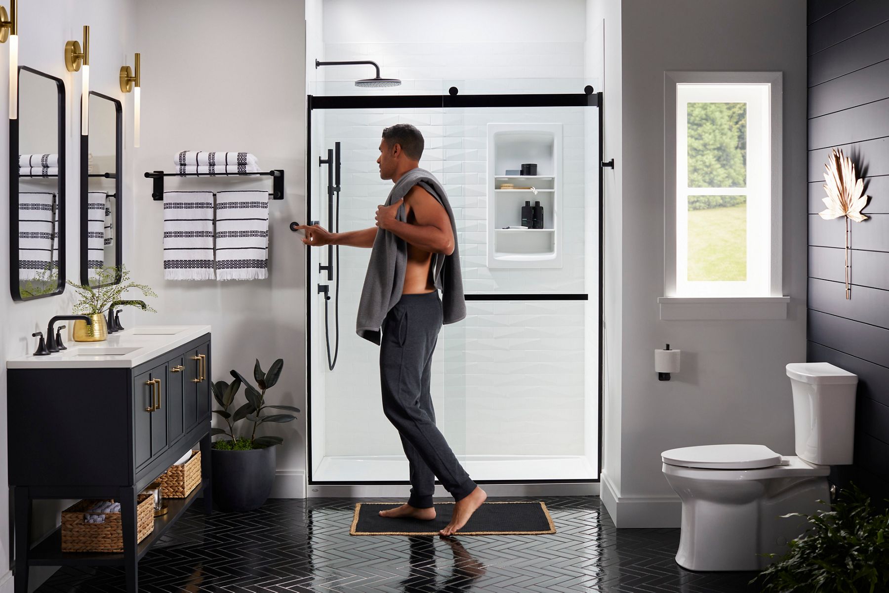 man setting shower temperature on dial