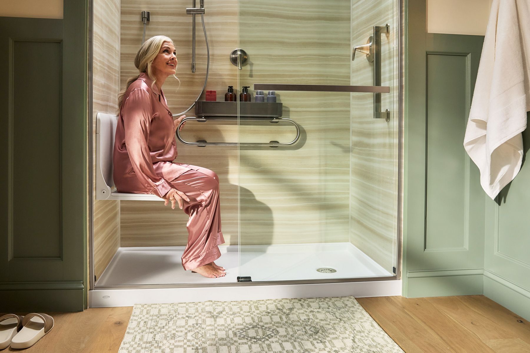woman sitting in a seat in shower