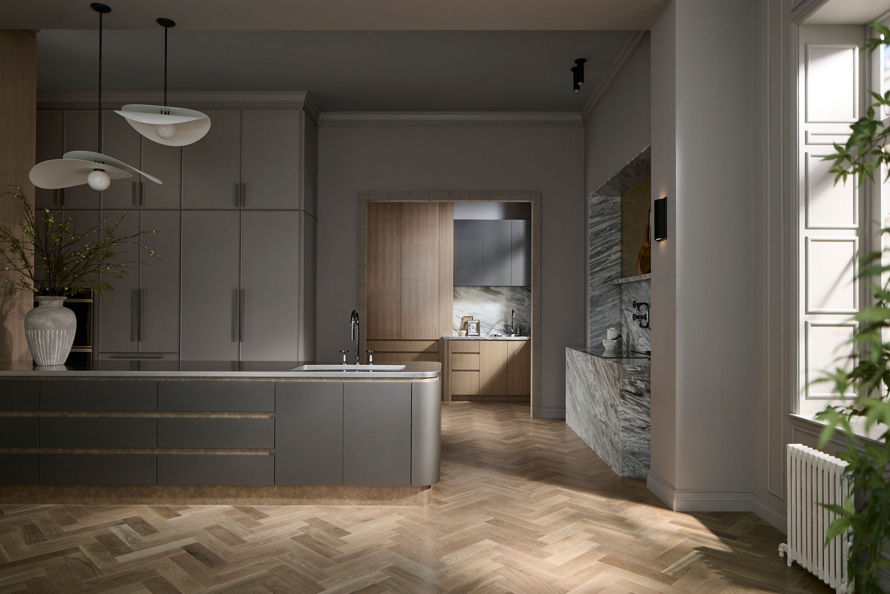 Modern kitchen interior featuring asleep island and built-in sink faucet part of the Billet kitchen faucet collection