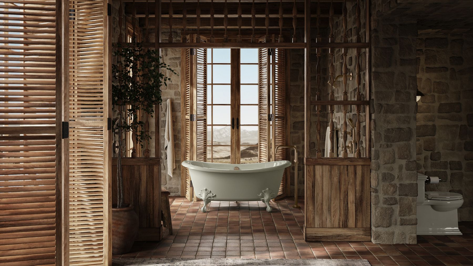 Rustic stone and wood bathroom featuring a clawfoot tub, terracotta tiled floor, and wooden shutters letting in desert sunlight.