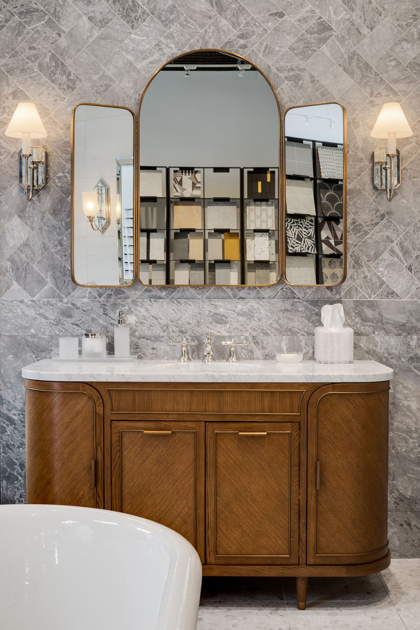 Ann Sacks Dallas showroom interior view of modern bathroom area with white bathtub