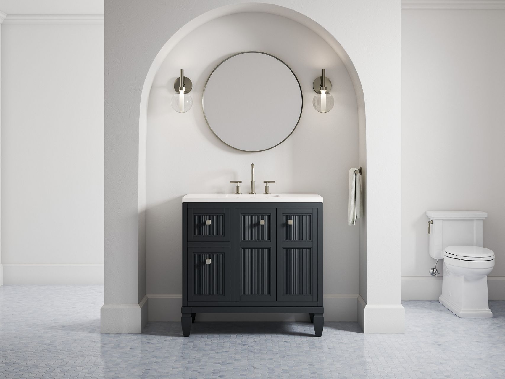 A 36-inch Hearthhaven vanity in slate grey along with a round mirror and two sconce lights in an off-white alcove with a rounded top.