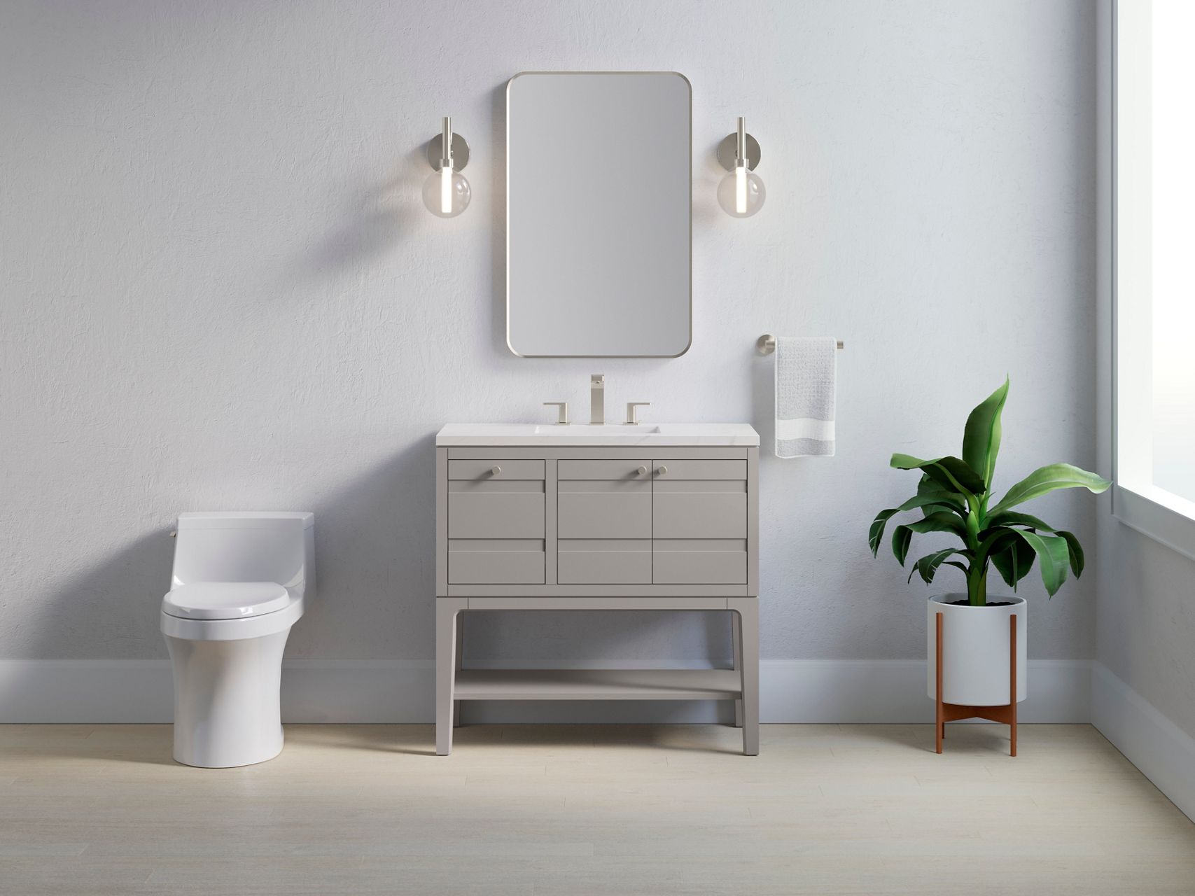 A bathroom styling space with a gray vanity, white counter top, widespread faucet, rectangular mirror and sconce lighting.