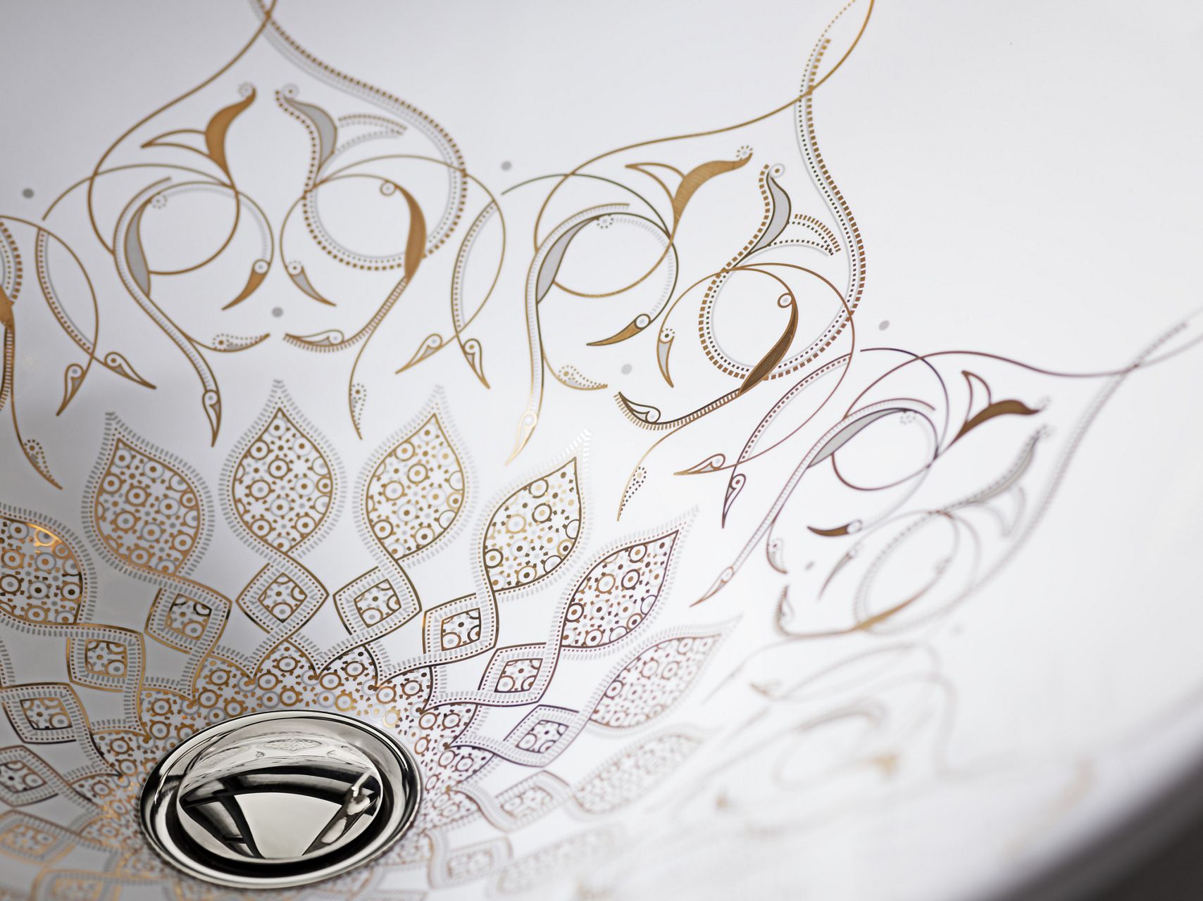 Closeup of fine details and artistic etchings with the bowl of the white Artist Editions, Caravan Collection on Conical Bell, vessel sink.