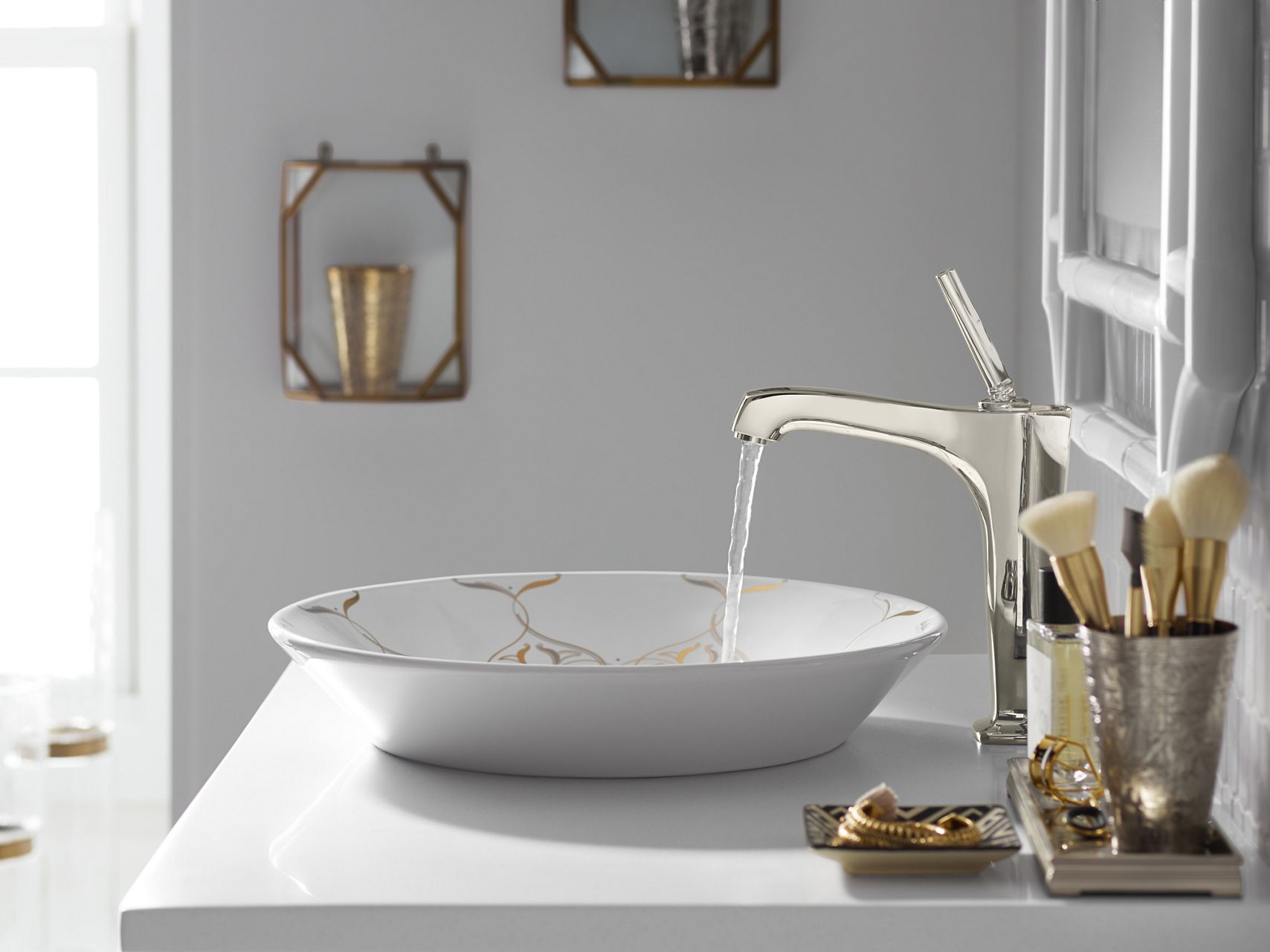 Bathroom in daylight with closeup profile of Margaux tall single-hole bathroom sink faucet in Vibrant Polished Nickel finish with water pouring into a white Artist Editions, Caravan Collection on Conical Bell, vessel bathroom sink.