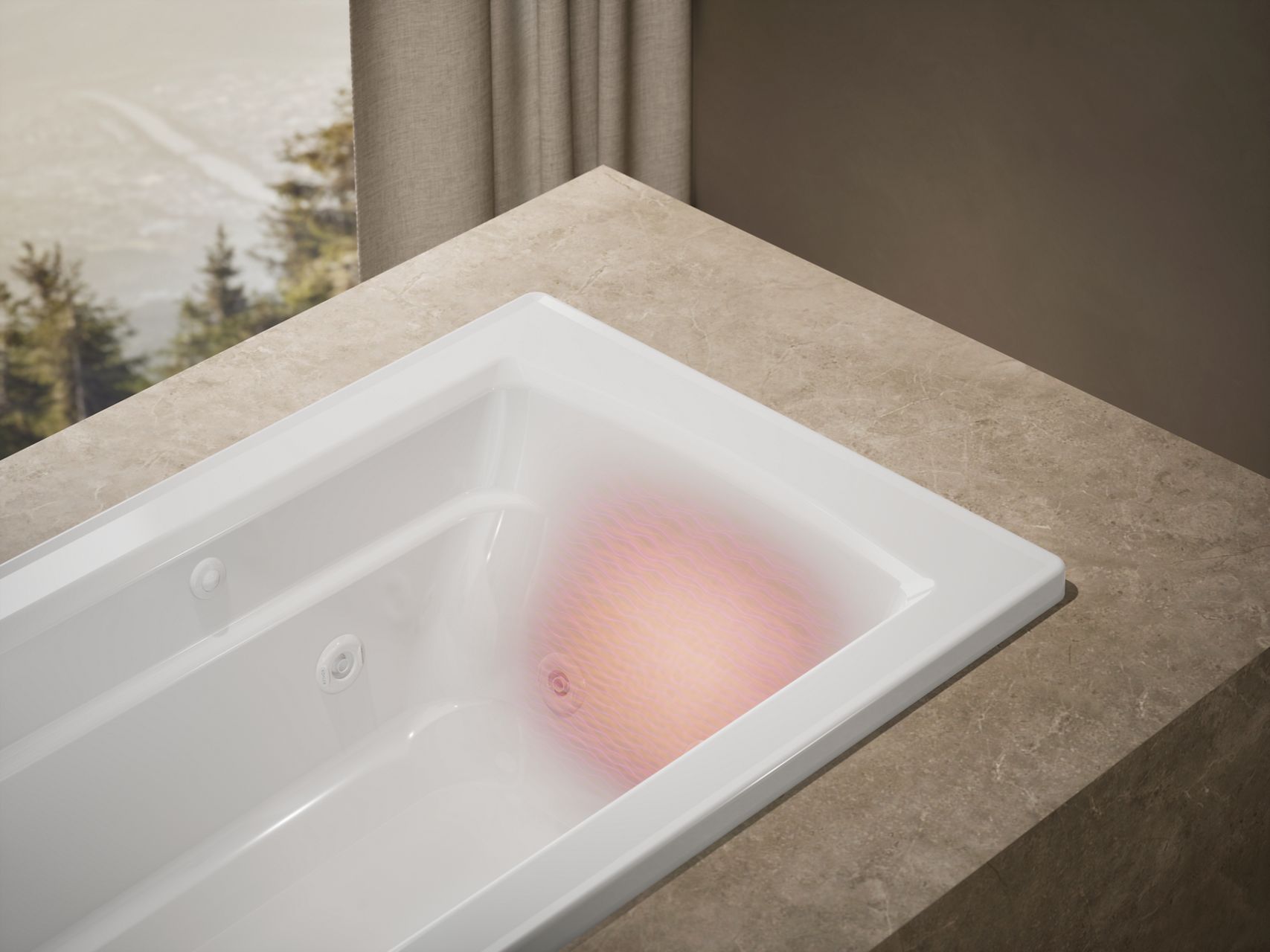 Bask Heated Surfaces warming a drop-in KOHLER bathtub.