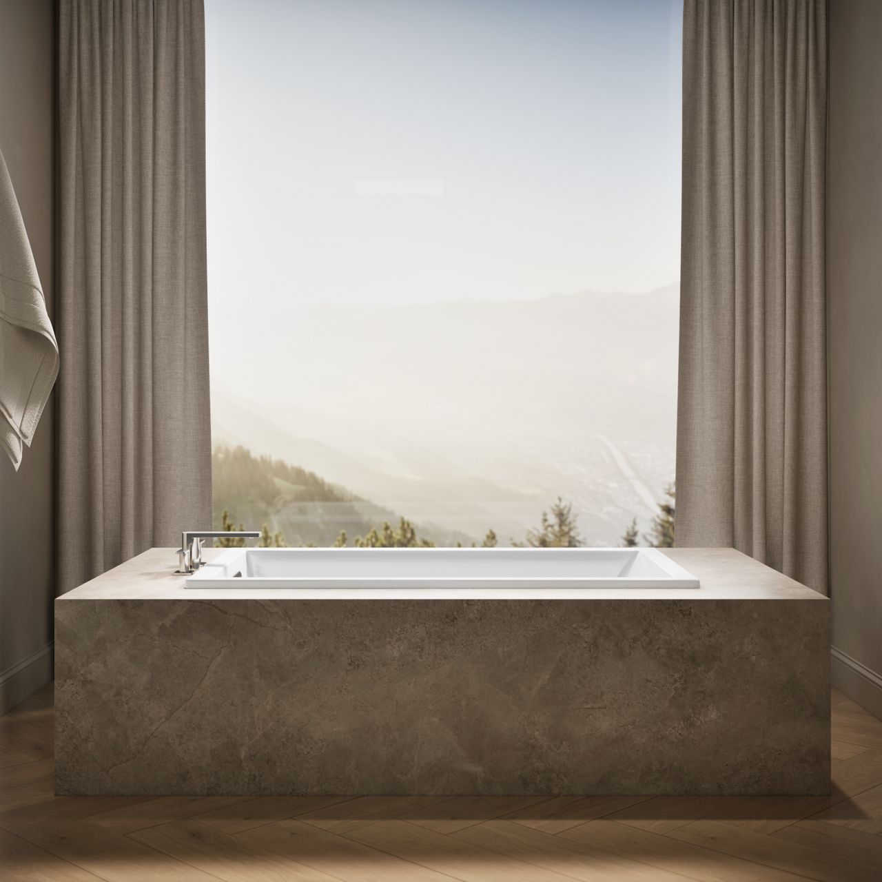KOHLER drop-in bath surrounded by a custom stone deck set next to a floor-to-ceiling window.