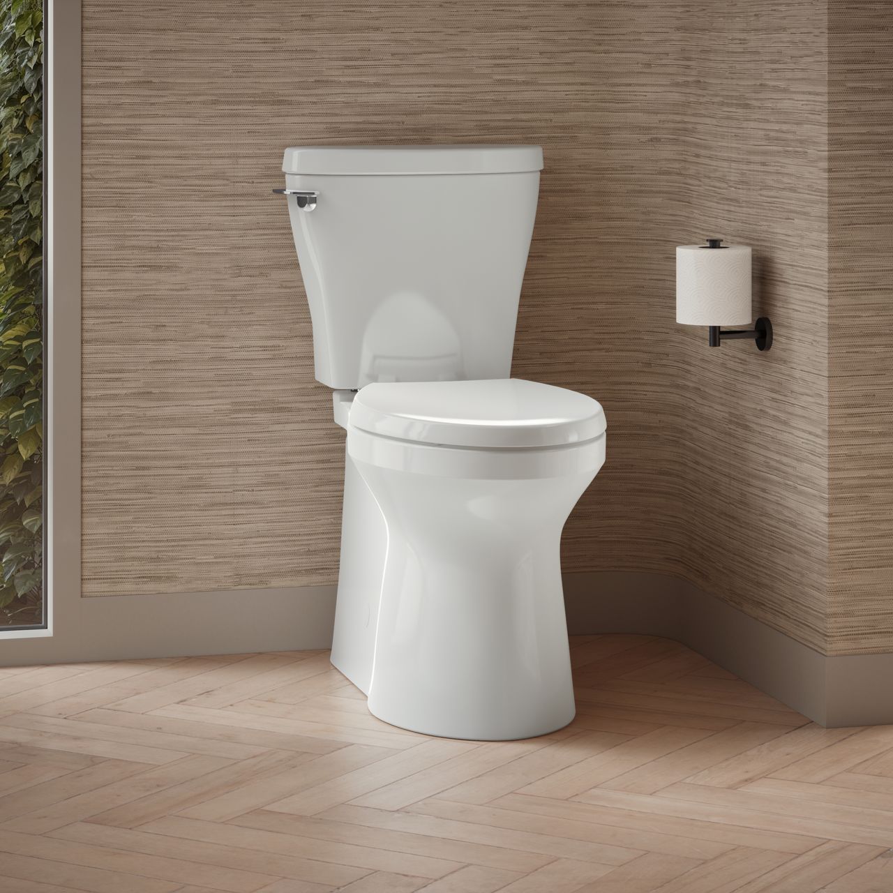 A white toilet against beige textured walls and hanging toilet paper