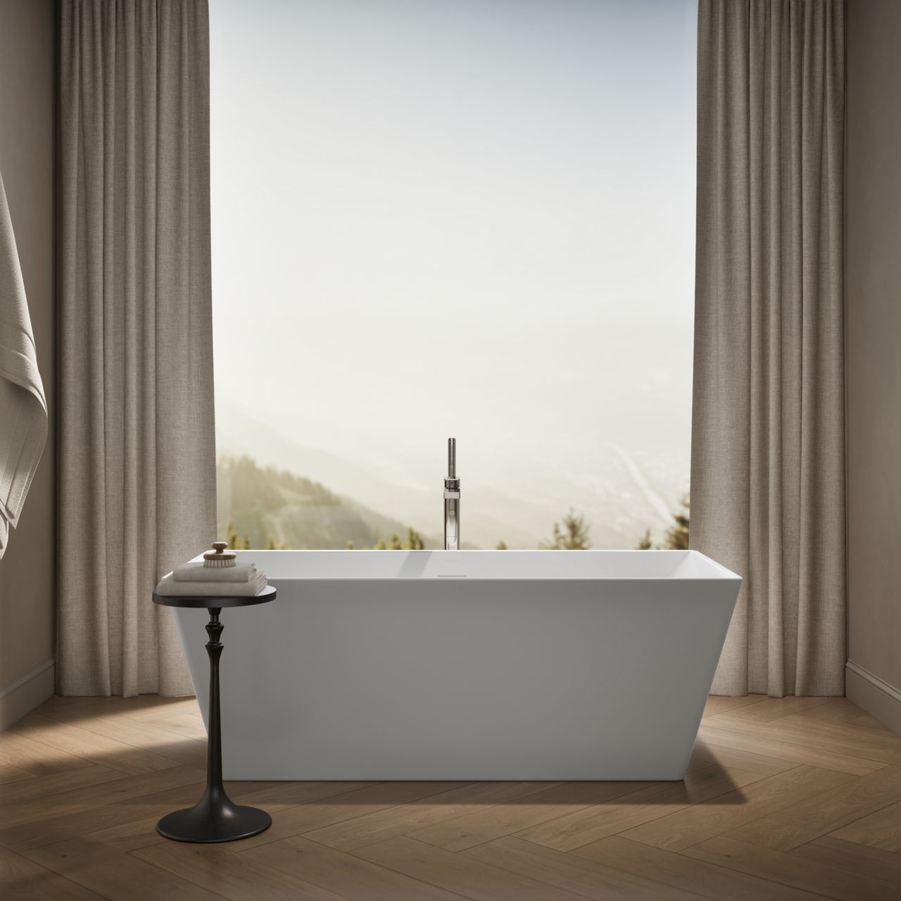 KOHLER freestanding bath in an elegant and airy bathroom set next to a floor-to-ceiling window.