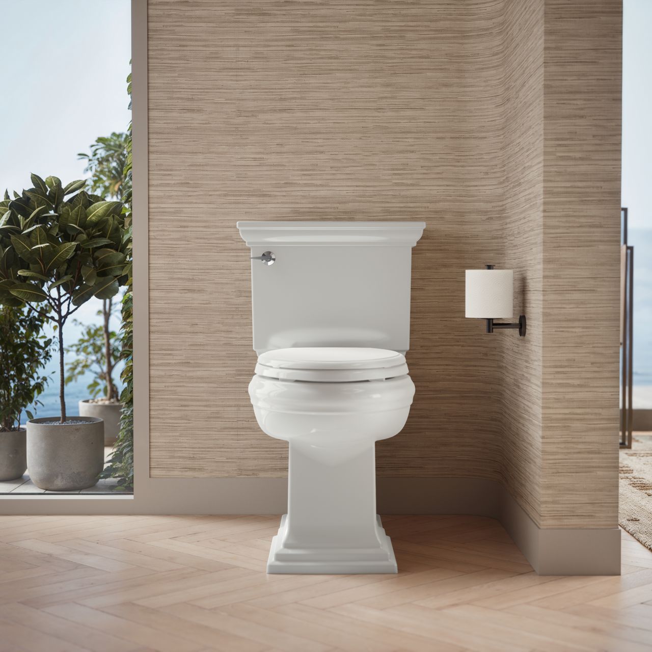 Traditional style white toilet with square base and toilet paper holder mounted on beige wall.