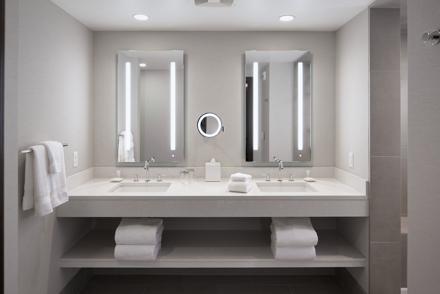 View of luminated double bathroom vanity
