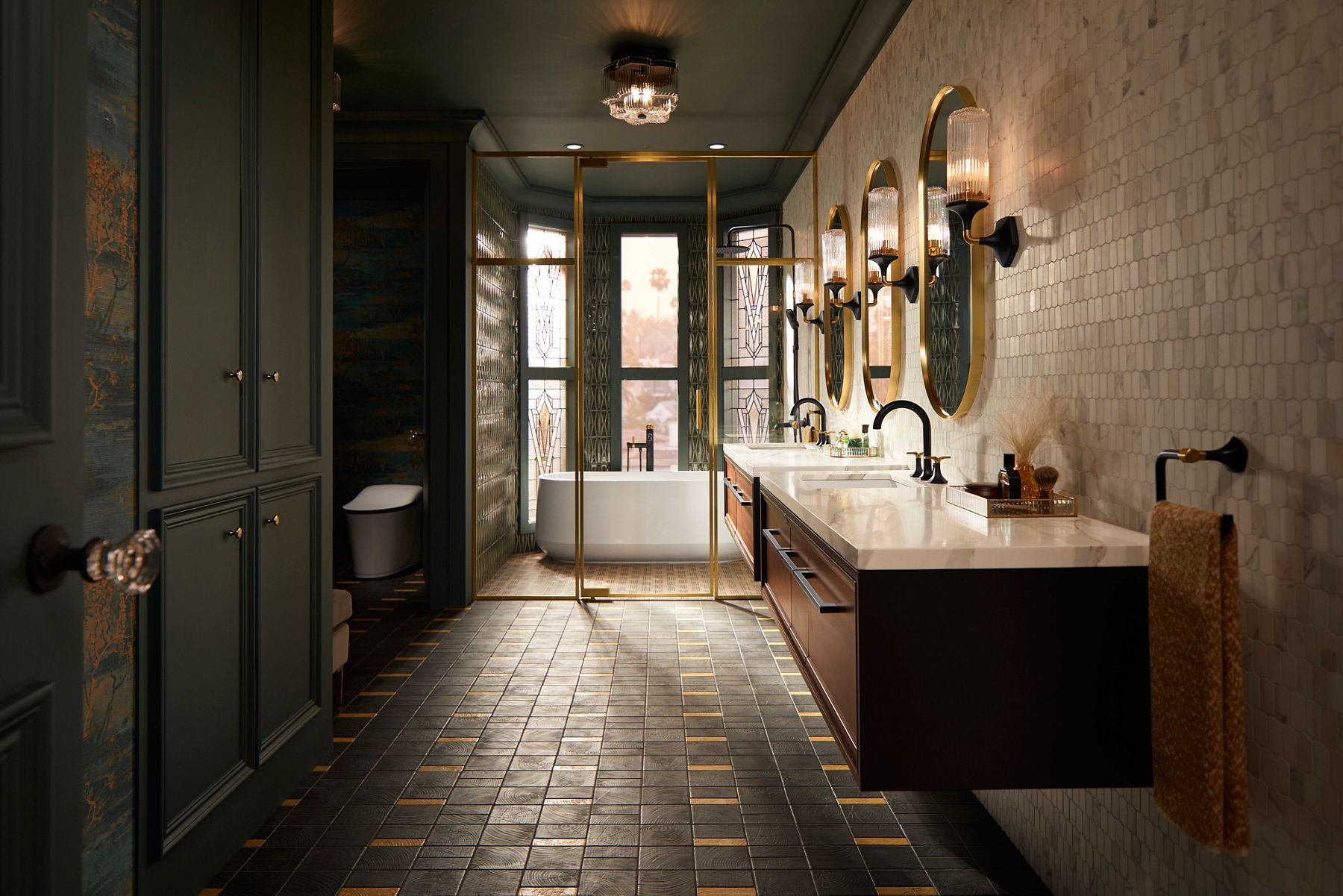 Luxurious bathroom with dual sinks, gold accents, and freestanding tub.