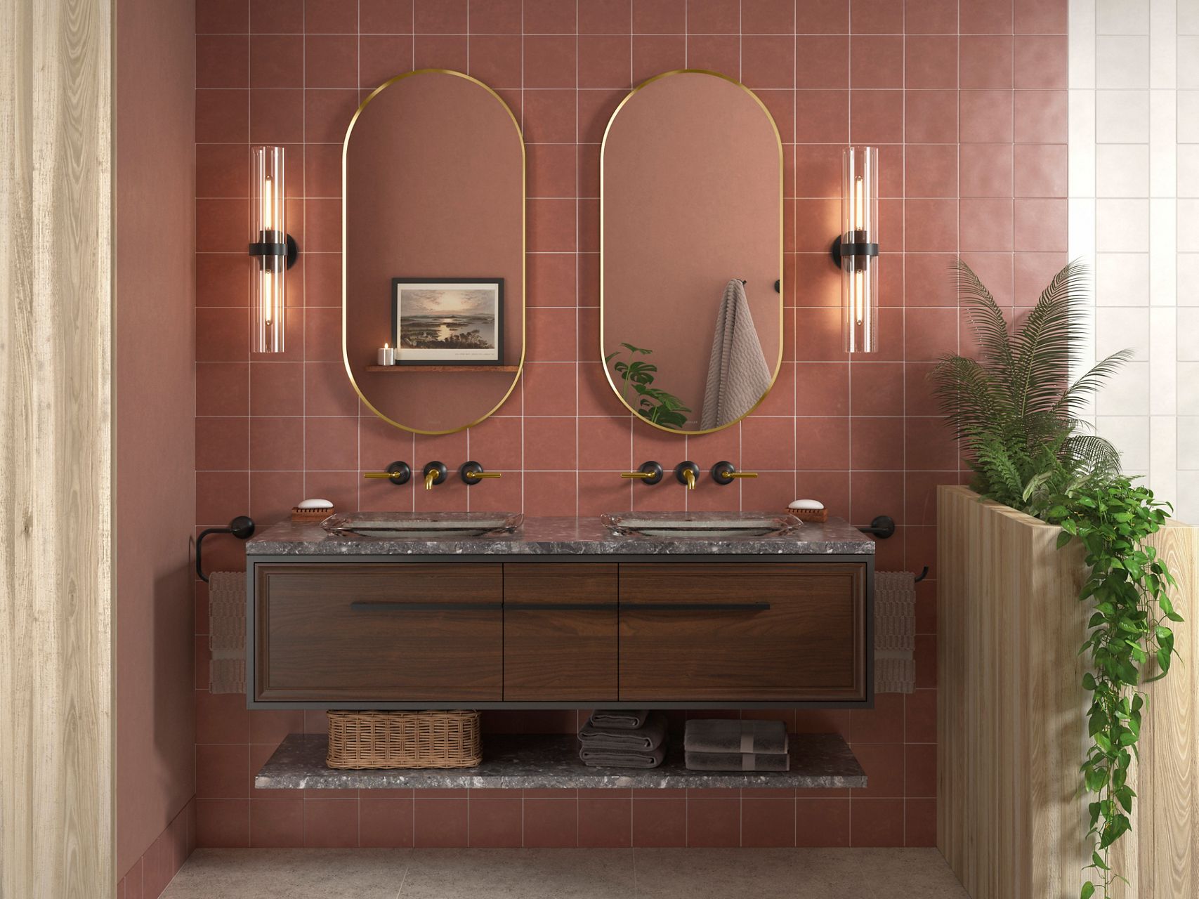 Bathroom with a double vanity, marble countertop, gold-framed oval mirrors, matte black and gold wall-mounted faucets, and terracotta tiled wall.