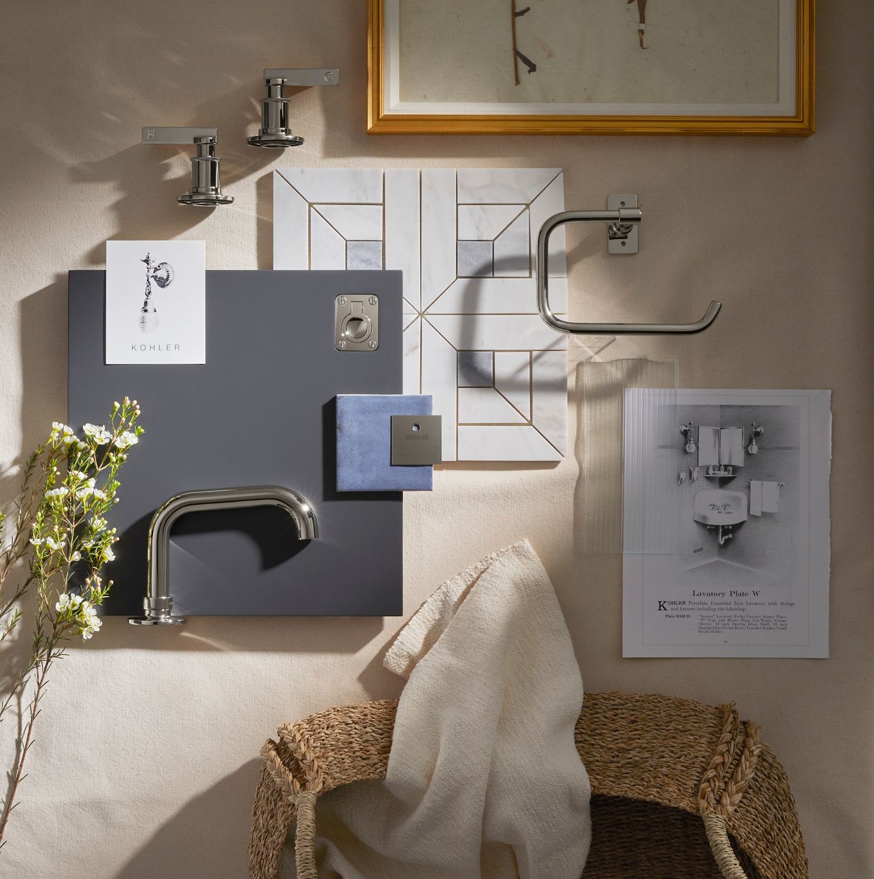 Bathroom design mood board featuring chrome fixtures, faucet sketches, material samples, and towels displayed on a beige wall.
