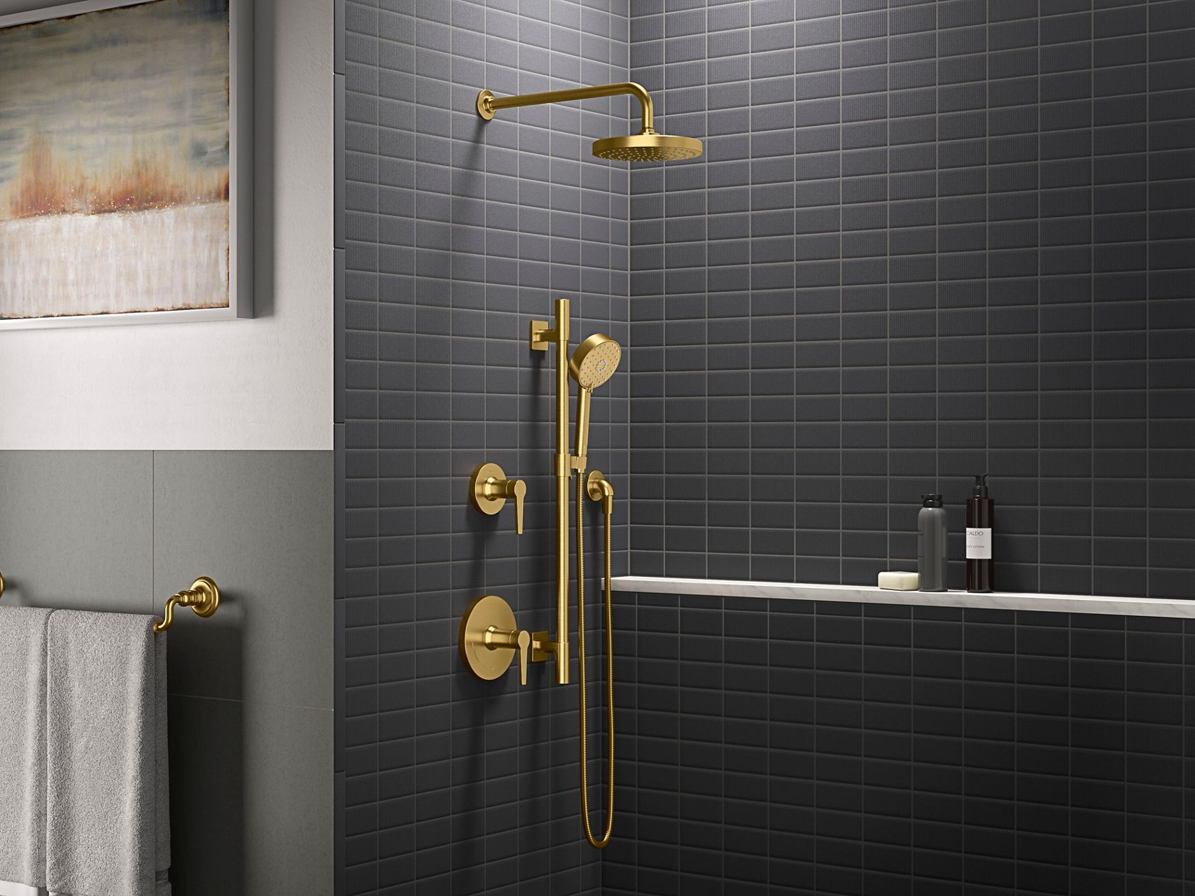 Grey tiled open shower with gold-toned shower valve and trim.