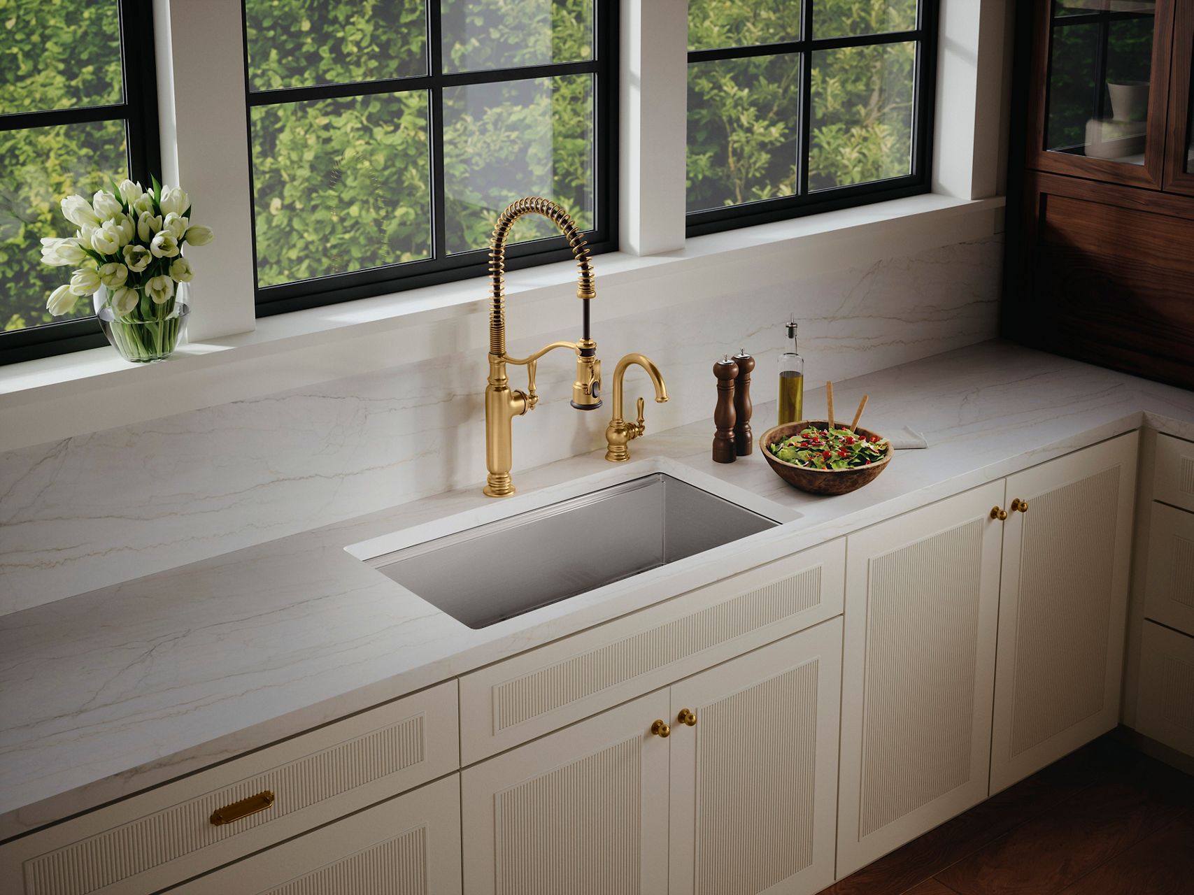 Strive® Kitchen Sink in gold in a bright white kitchen with a fresh meal set off to the side.