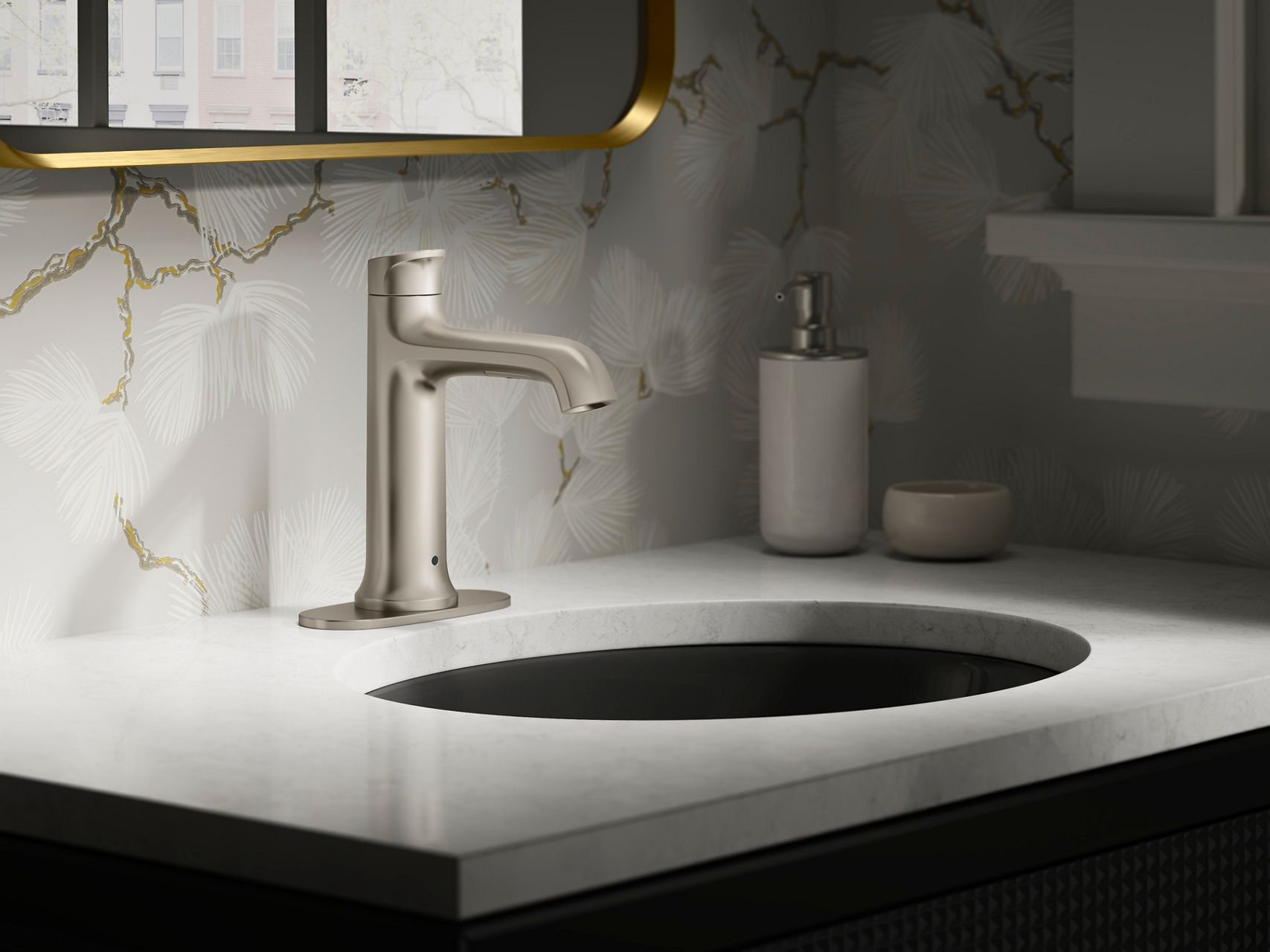 Modern bathroom vanity with a brushed nickel faucet mounted on a white countertop sink, styled with decorative wallpaper, soft lighting, and minimal countertop accessories.