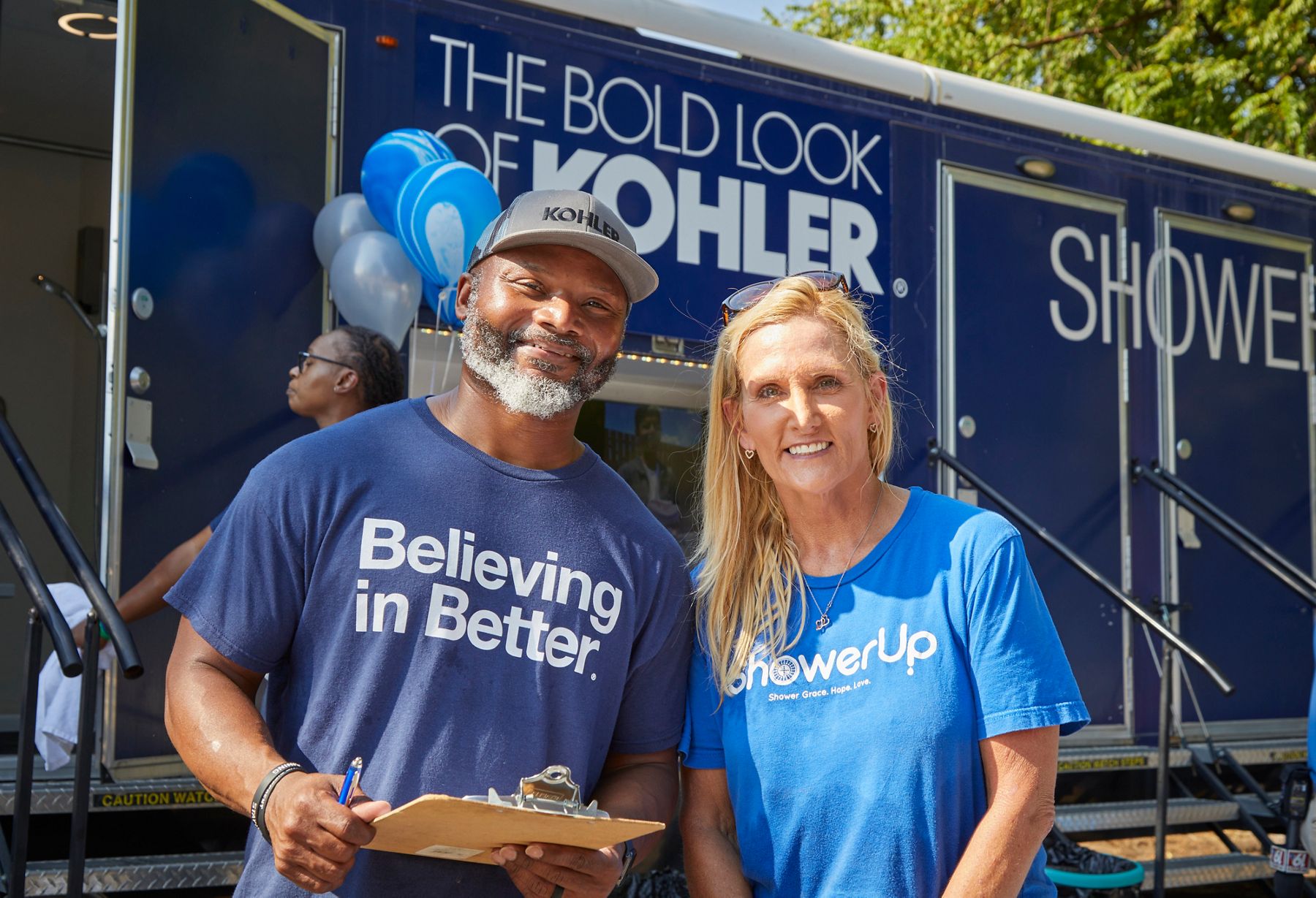 Representatives wearing “Believing in Better” shirts at a Kohler Power of Partnerships event.