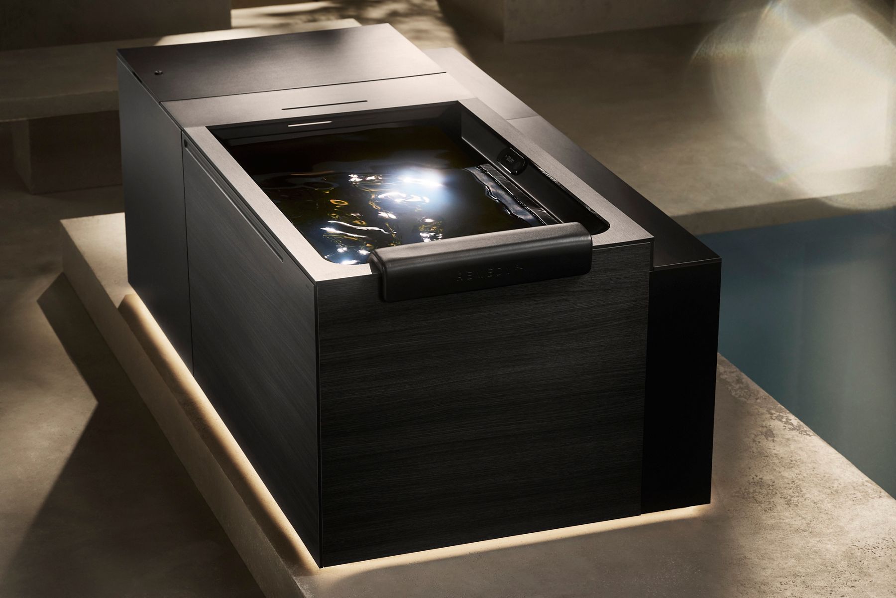 Luxurious Kohler Ice Bath with sunlight shining on the water.