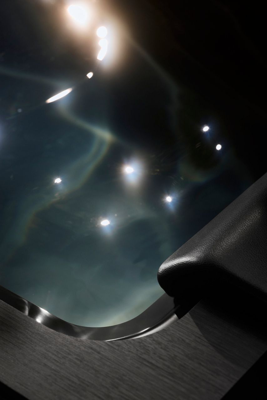 Glistening water within the tub of an ice bath.
