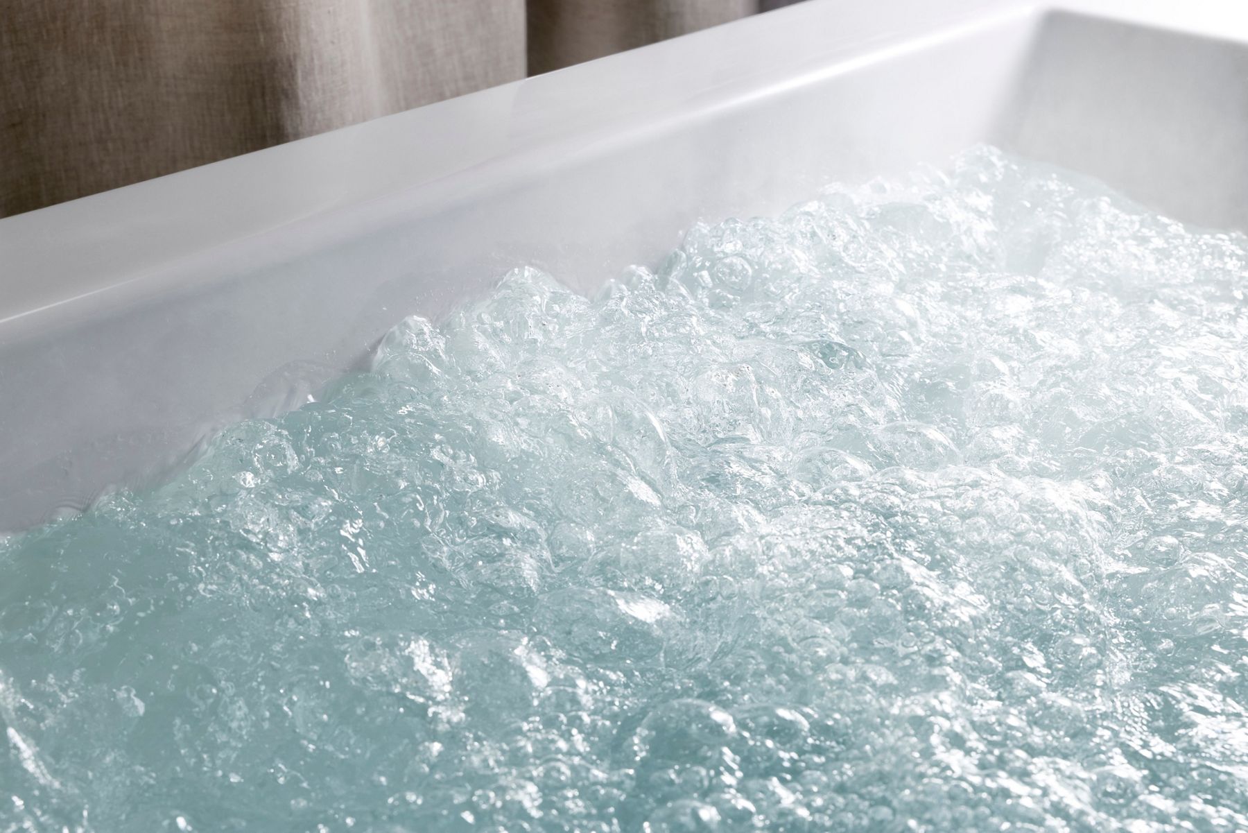 Heated BubbleMassage creating thousands of heated bubbles within a KOHLER bathtub.