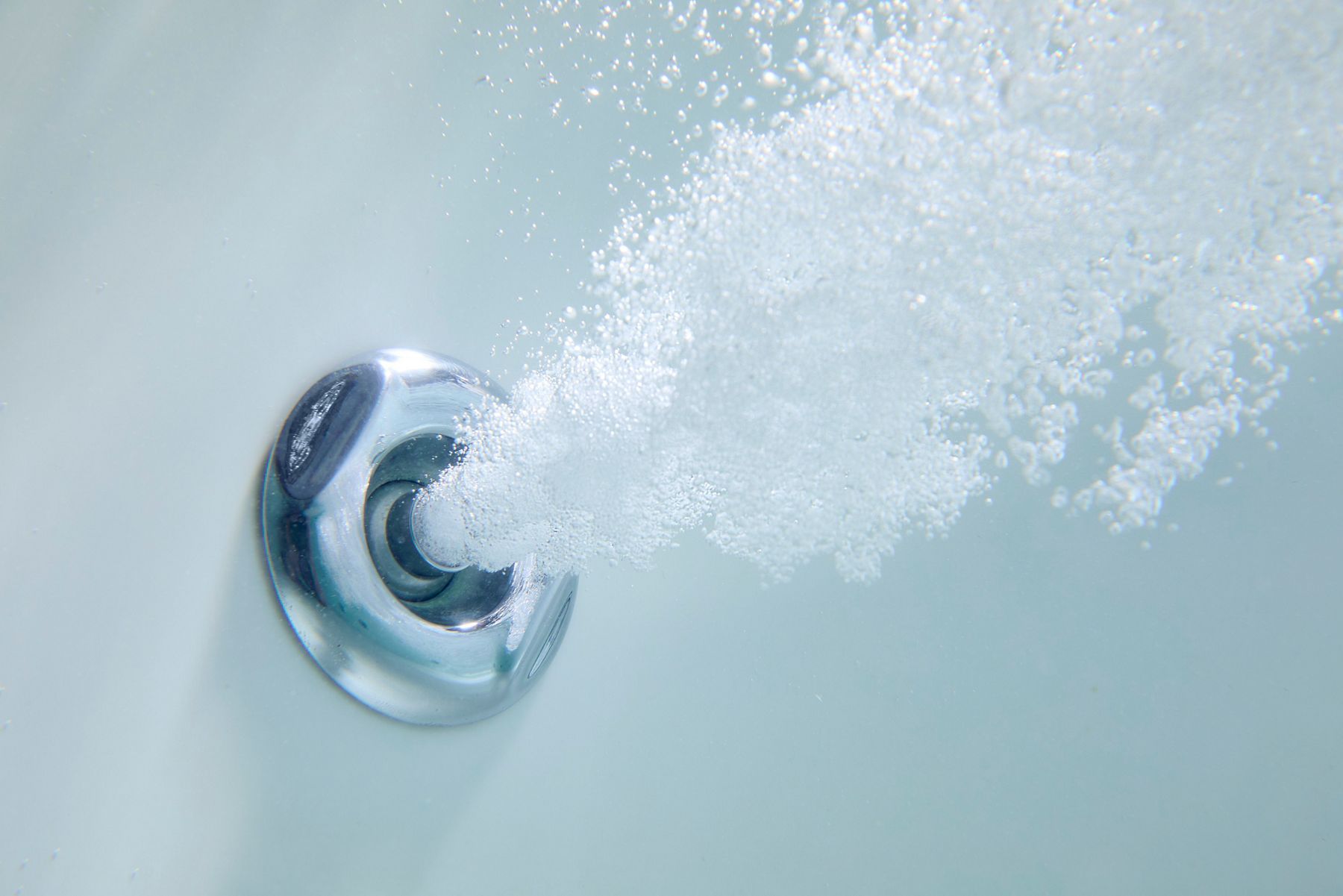 Hydrotherapy whirlpool in action within a KOHLER bathtub.