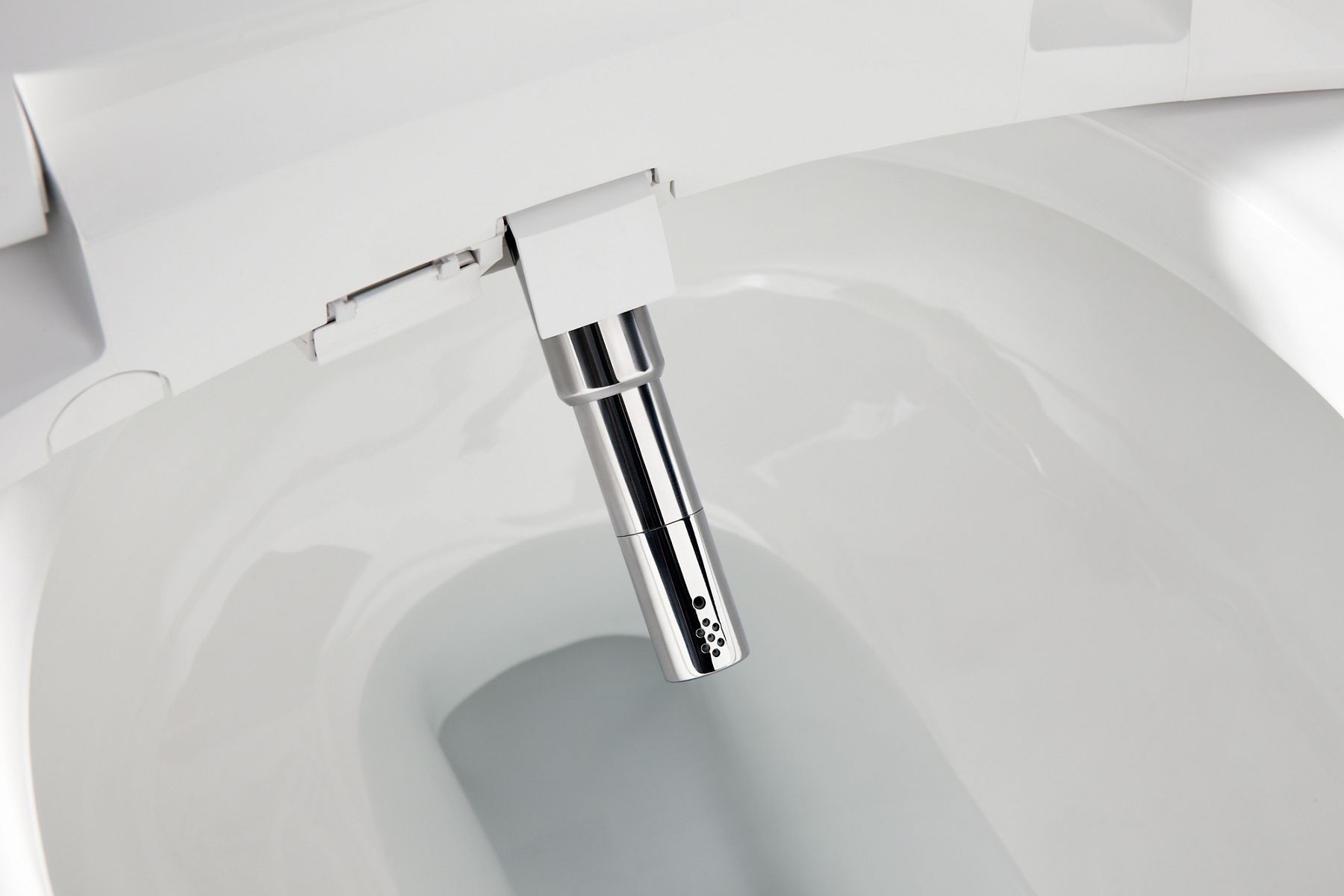 The cleansing spray nozzle of a toilet seat with bidet functionality.