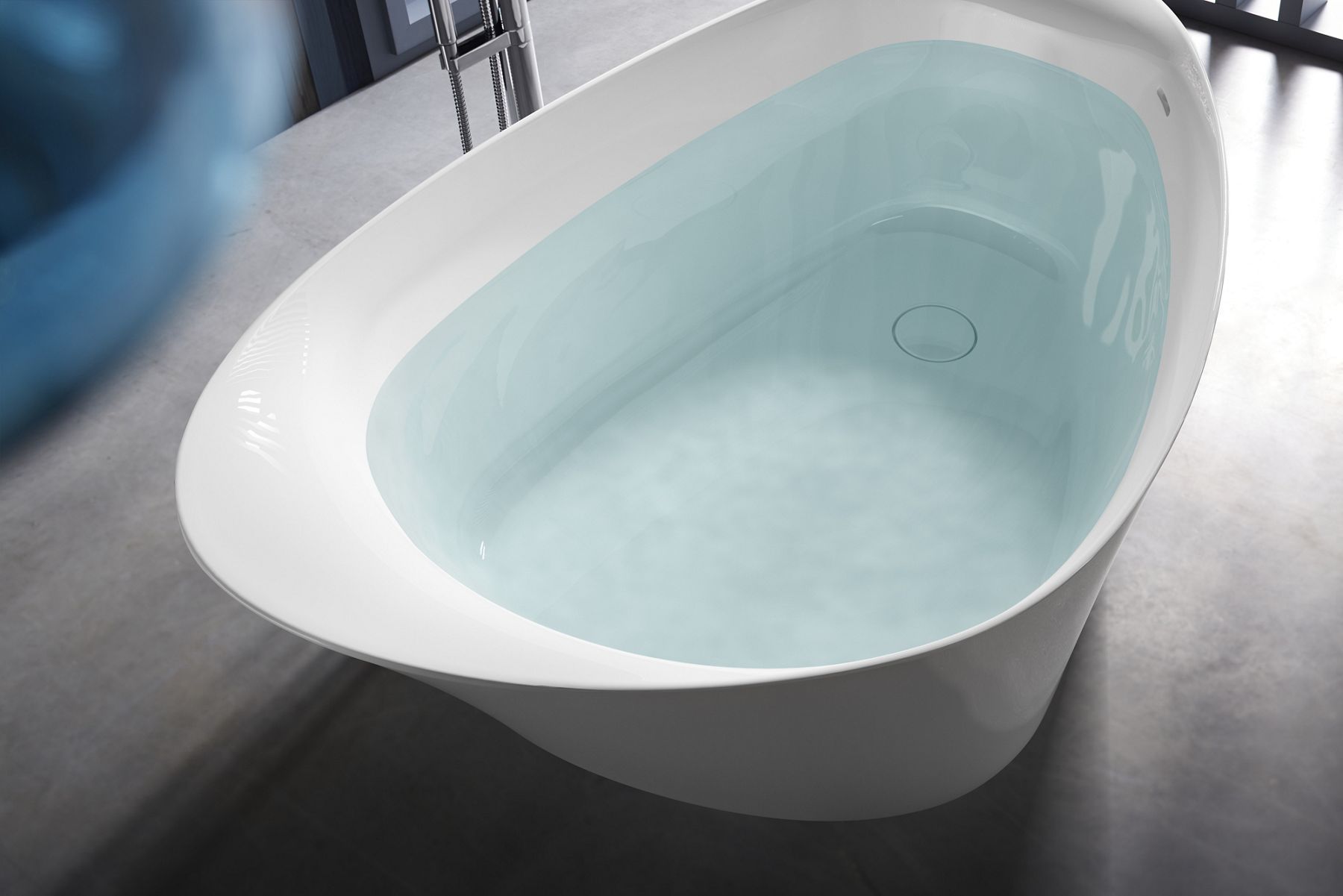 Detail of a lithocast bath filled with water.