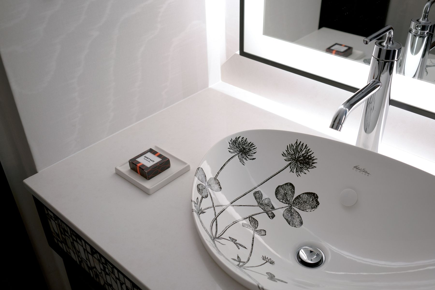 Black and white closeup of  Kohler’s Artist Editions™ sink with floral imagery in its interior.
