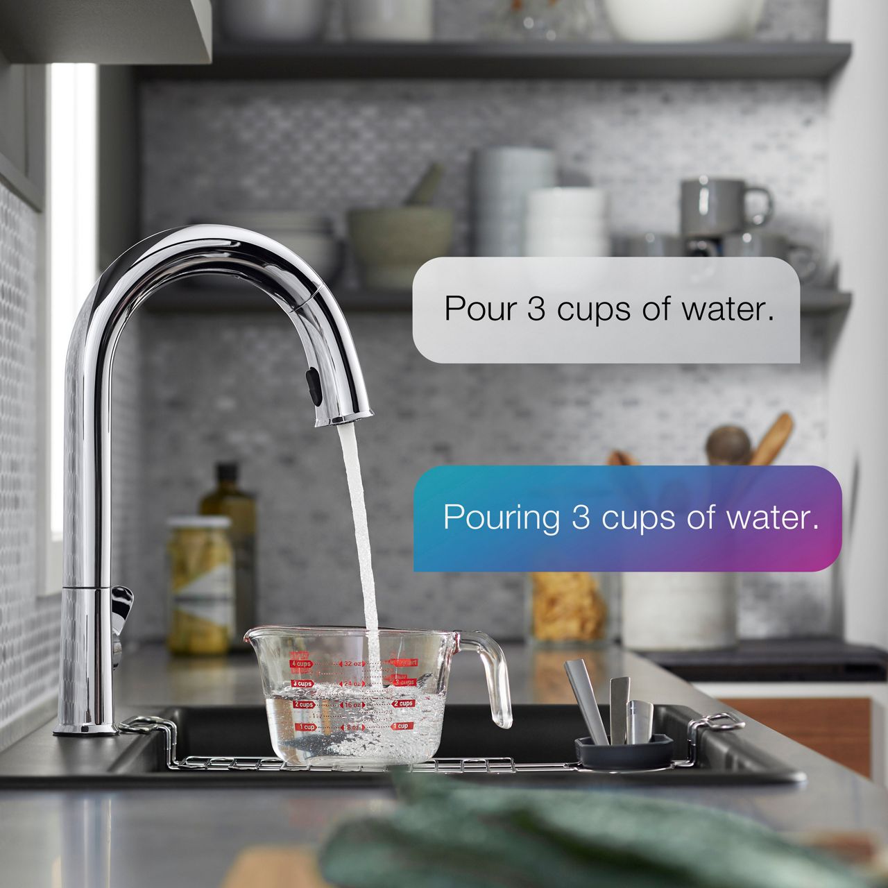 KOHLER Konnect faucet pouring water into glass measuring cup