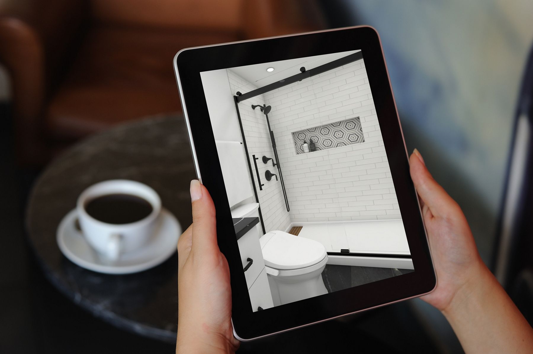 Tablet showing a digital rendering of a modern bathroom
