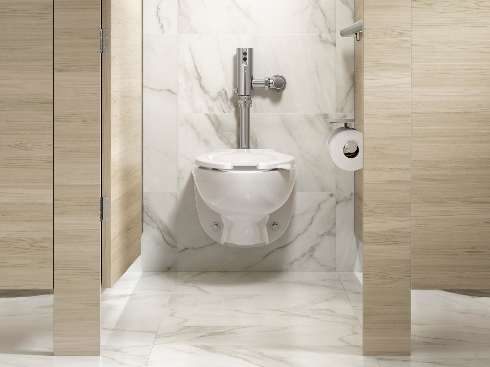 A white toilet with a chrome flushometer engine above it set against a white and gray marble wall.