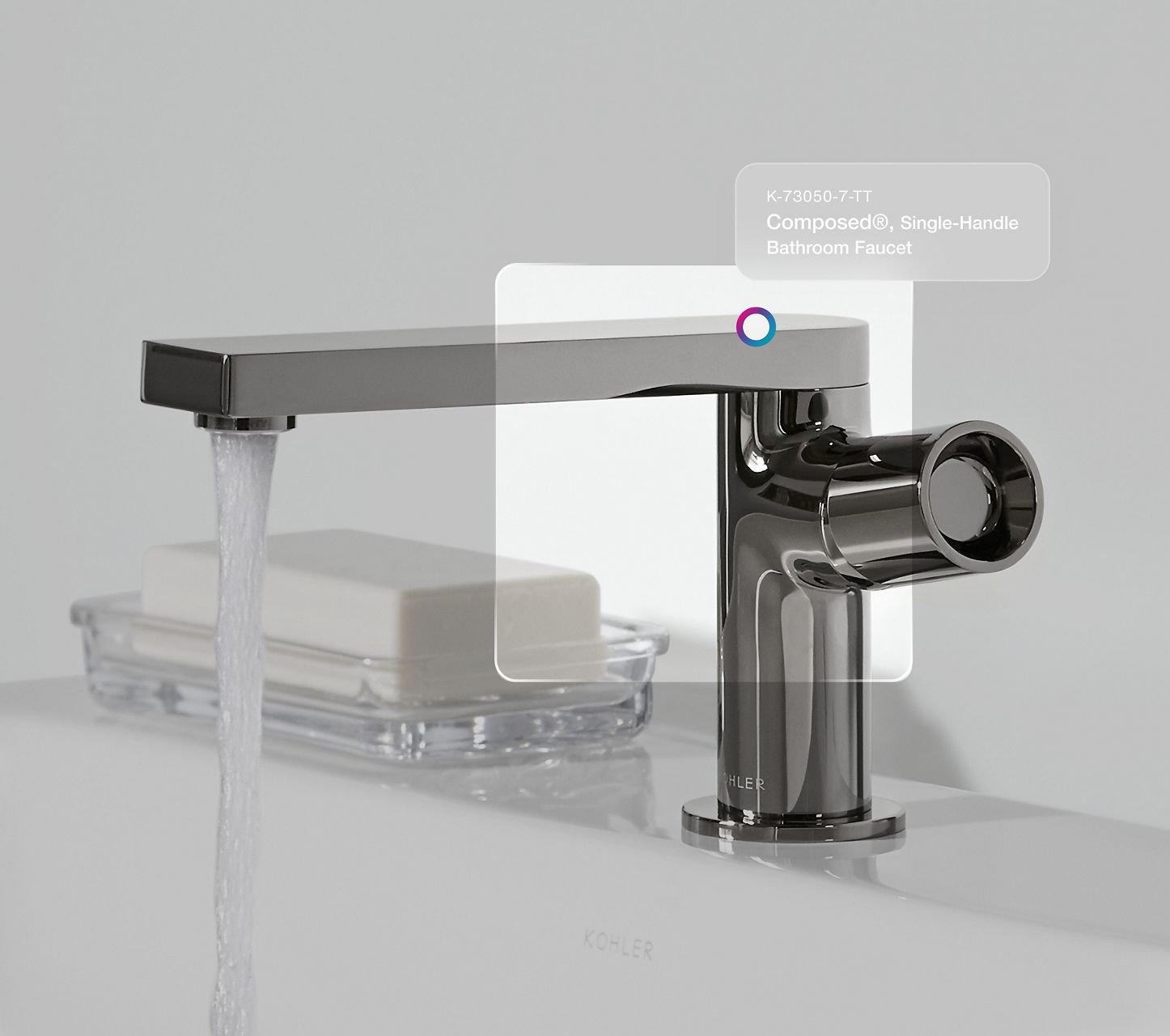 Modern chrome bathroom faucet with product recognition overlay.