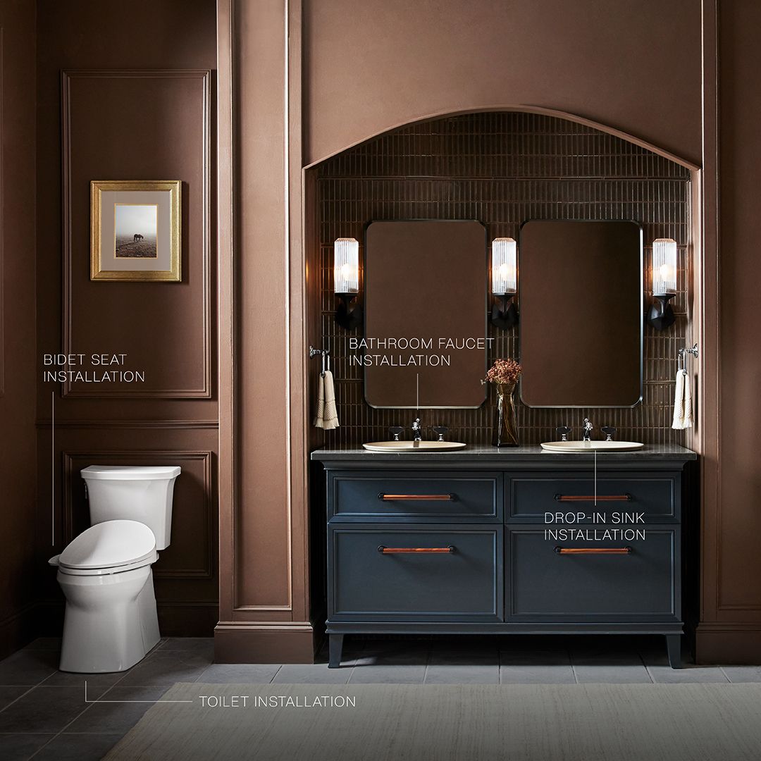 Modern bathroom with a white toilet and dark vanity under a mirror, promoting 10% savings with installation services.
