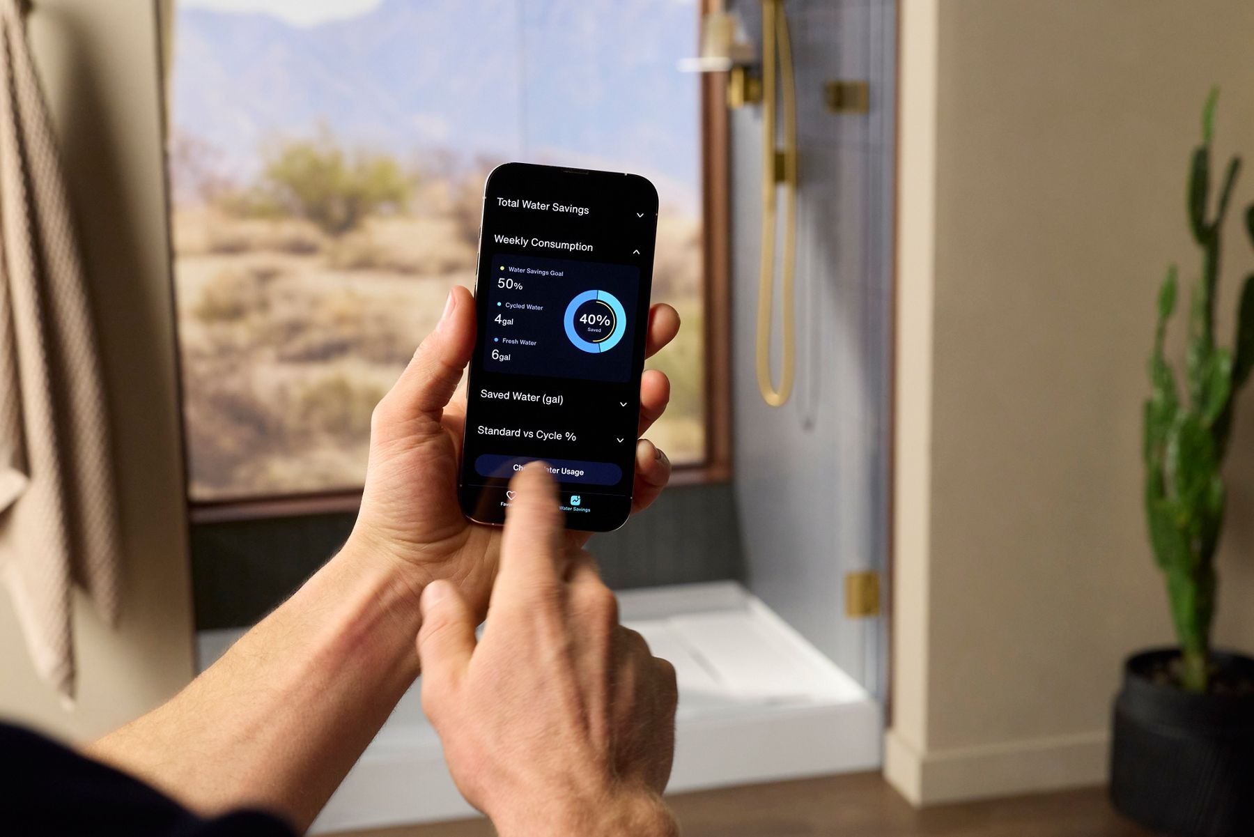 Man using KOHLER Konnect app to customize his Anthem EvoCycle smart shower.