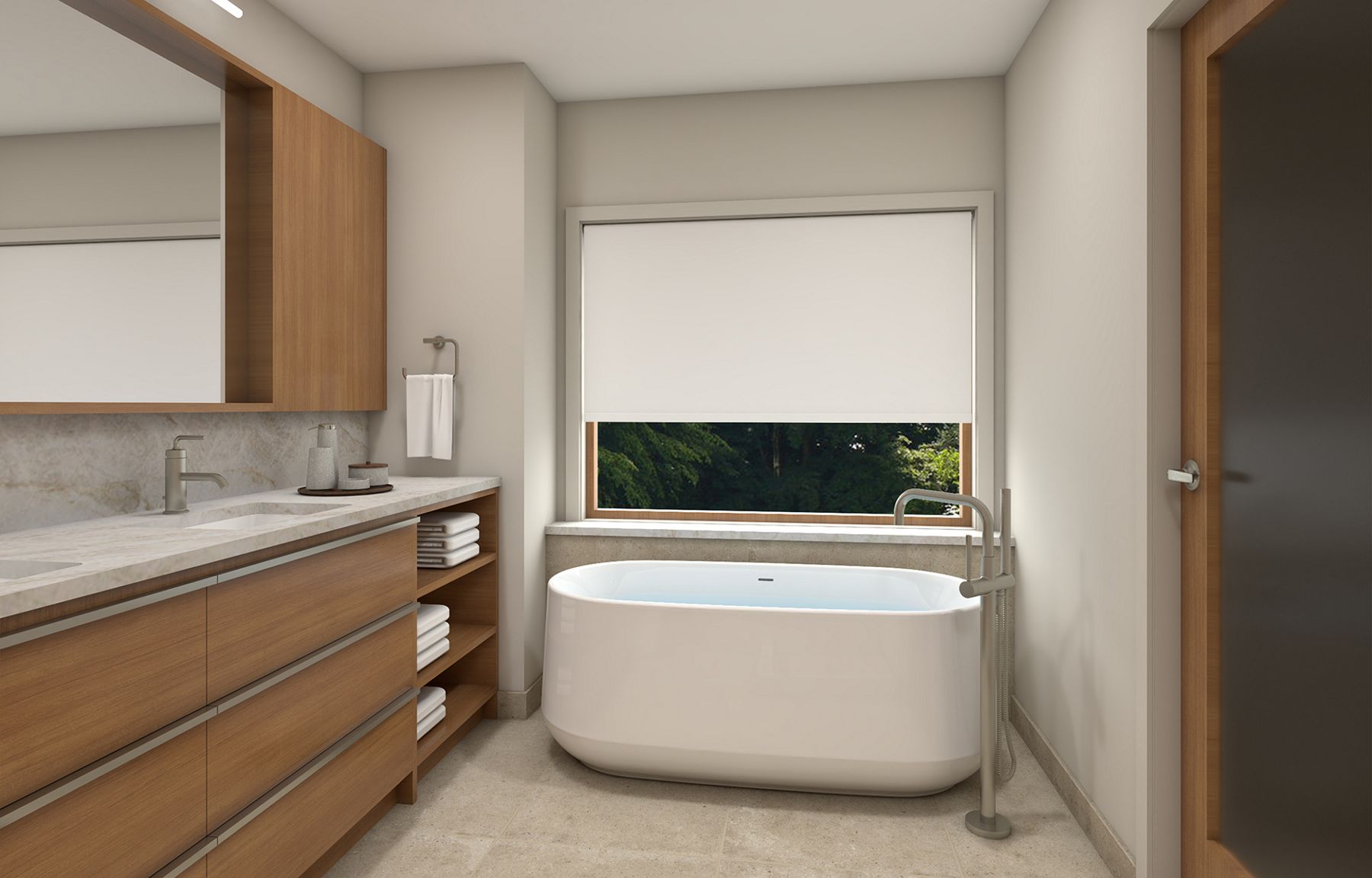 Freestanding bathtub next to vanity with wooden cabinets in a contemporary bathroom with large window and roller shade.