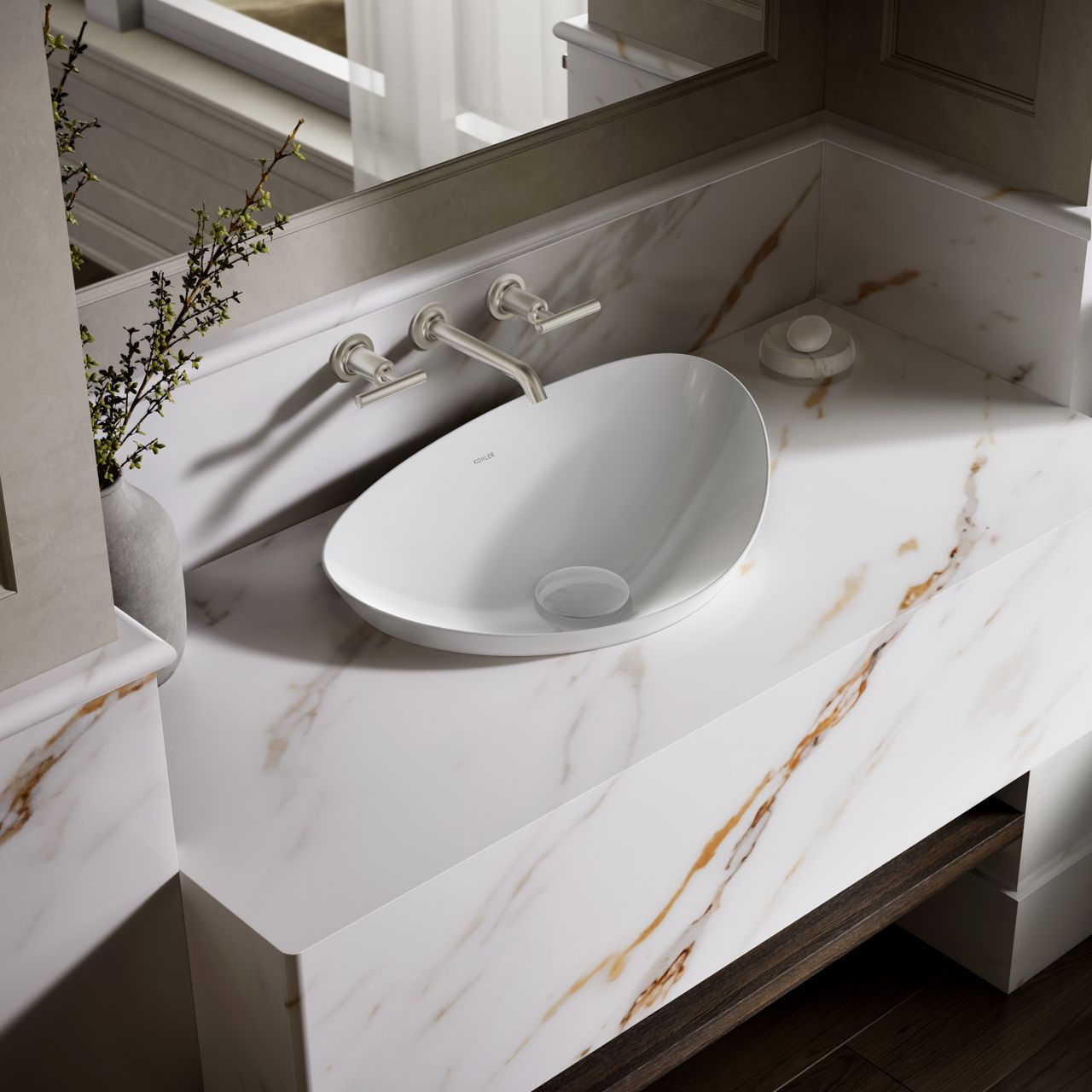 Close-up of a luxury bathroom vanity featuring a white oval vessel sink, wall-mounted faucets, and a marble countertop with warm gold veining.
