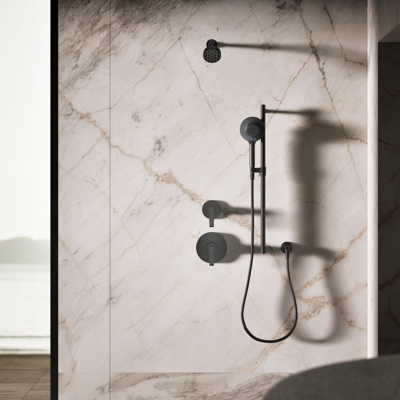 Minimalist matte black round shower valve controls mounted on a marble wall.