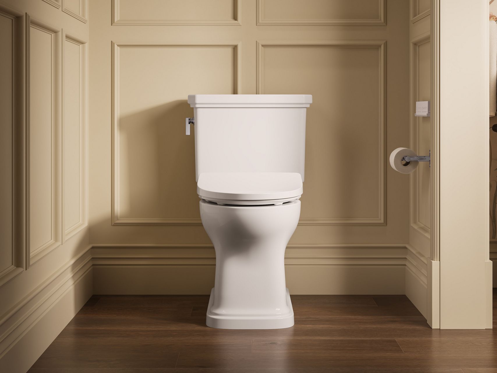 White two-piece toilet displayed against paneled walls in a traditional bathroom with dark wood flooring.