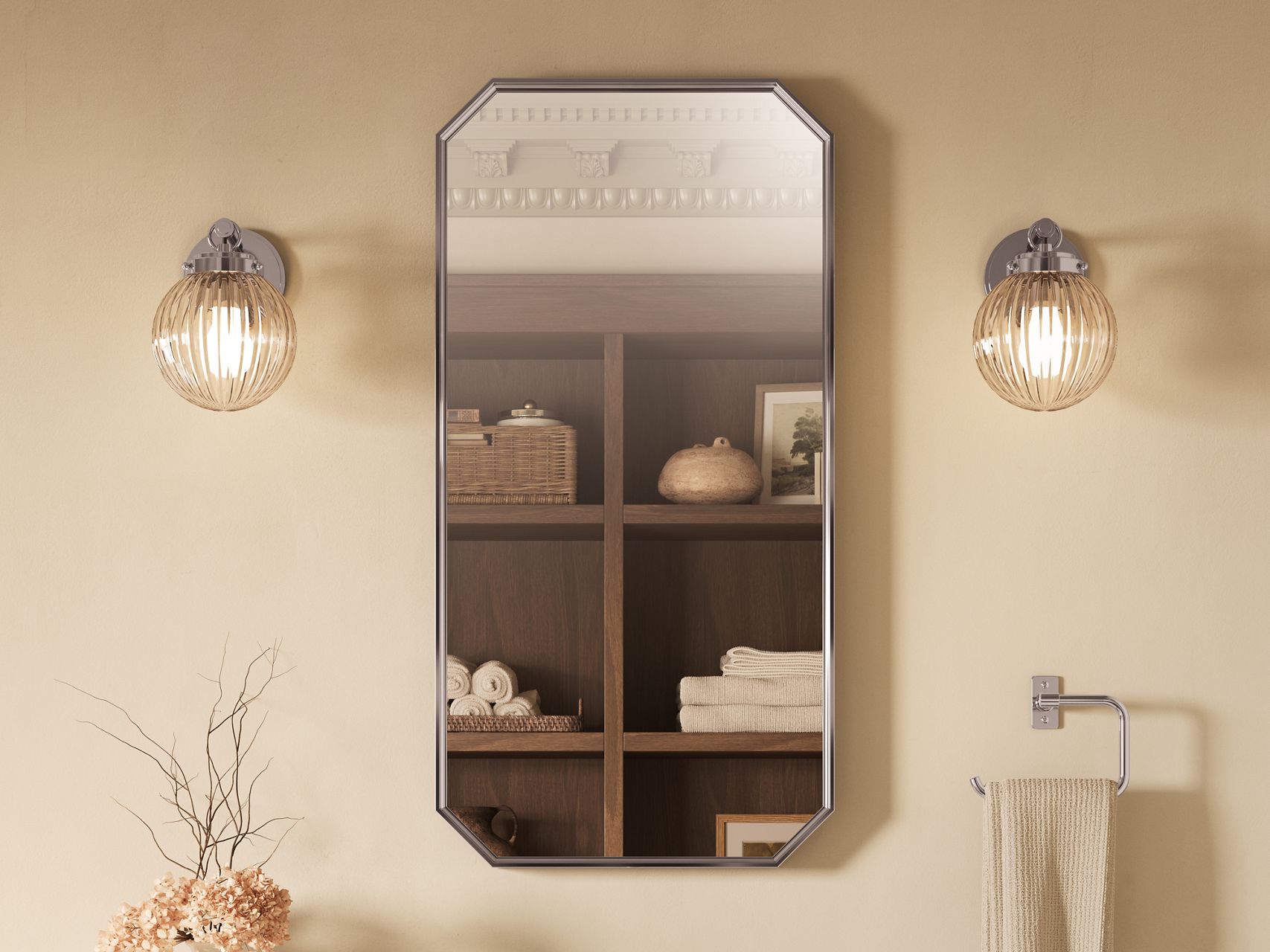 Octagonal framed mirror with ribbed glass sconces mounted above a towel bar in a warm, traditional bathroom setting.