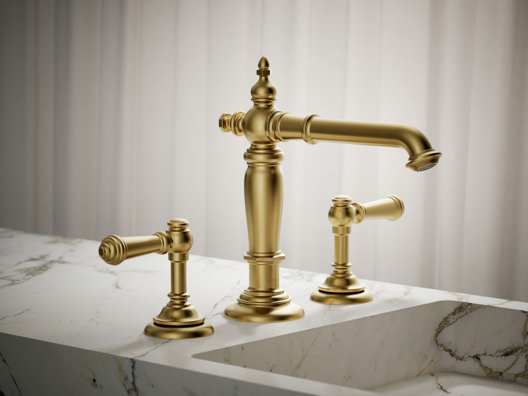 KOHLER Artifacts widespread bundle faucet in polished brass finish, installed on a white vanity.