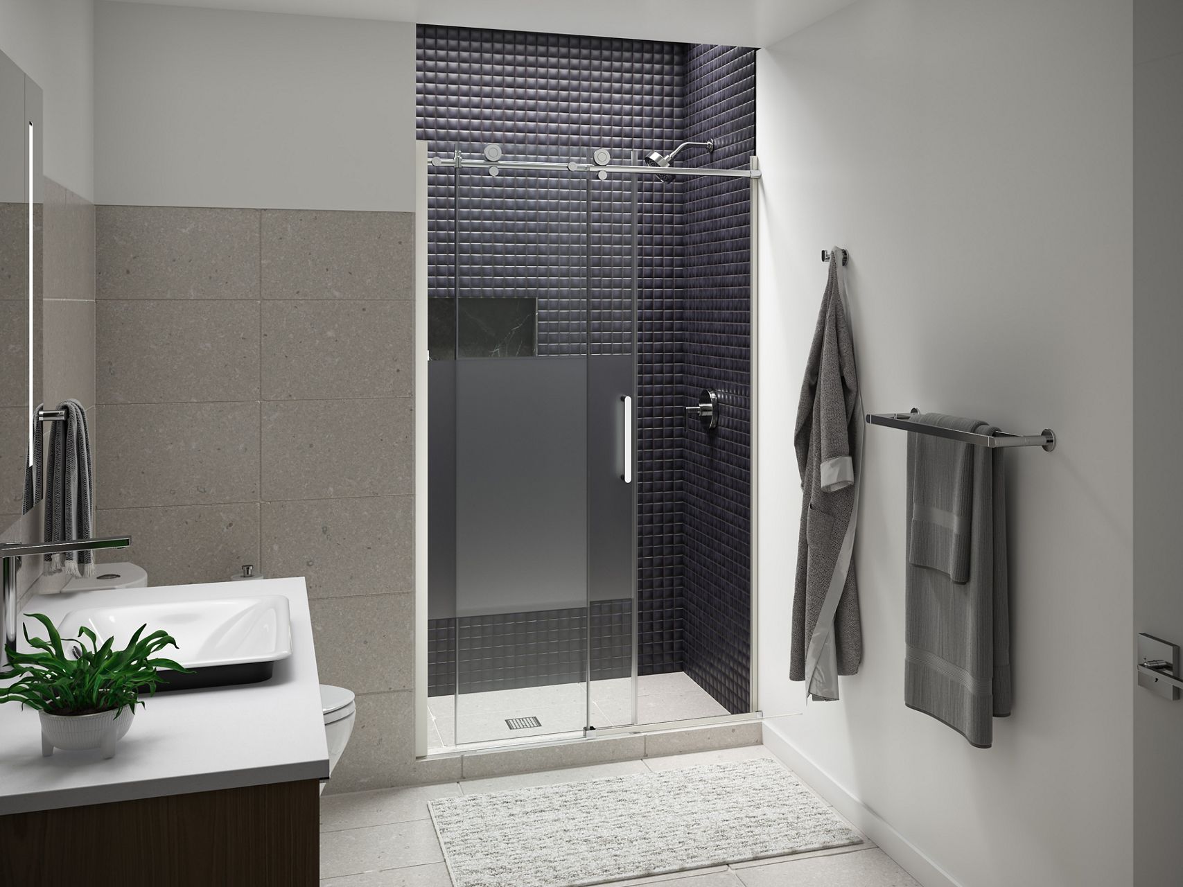 Contemporary bathroom featuring a glass shower enclosure, dark mosaic tile wall, floating vanity, and coordinated towel accessories.
