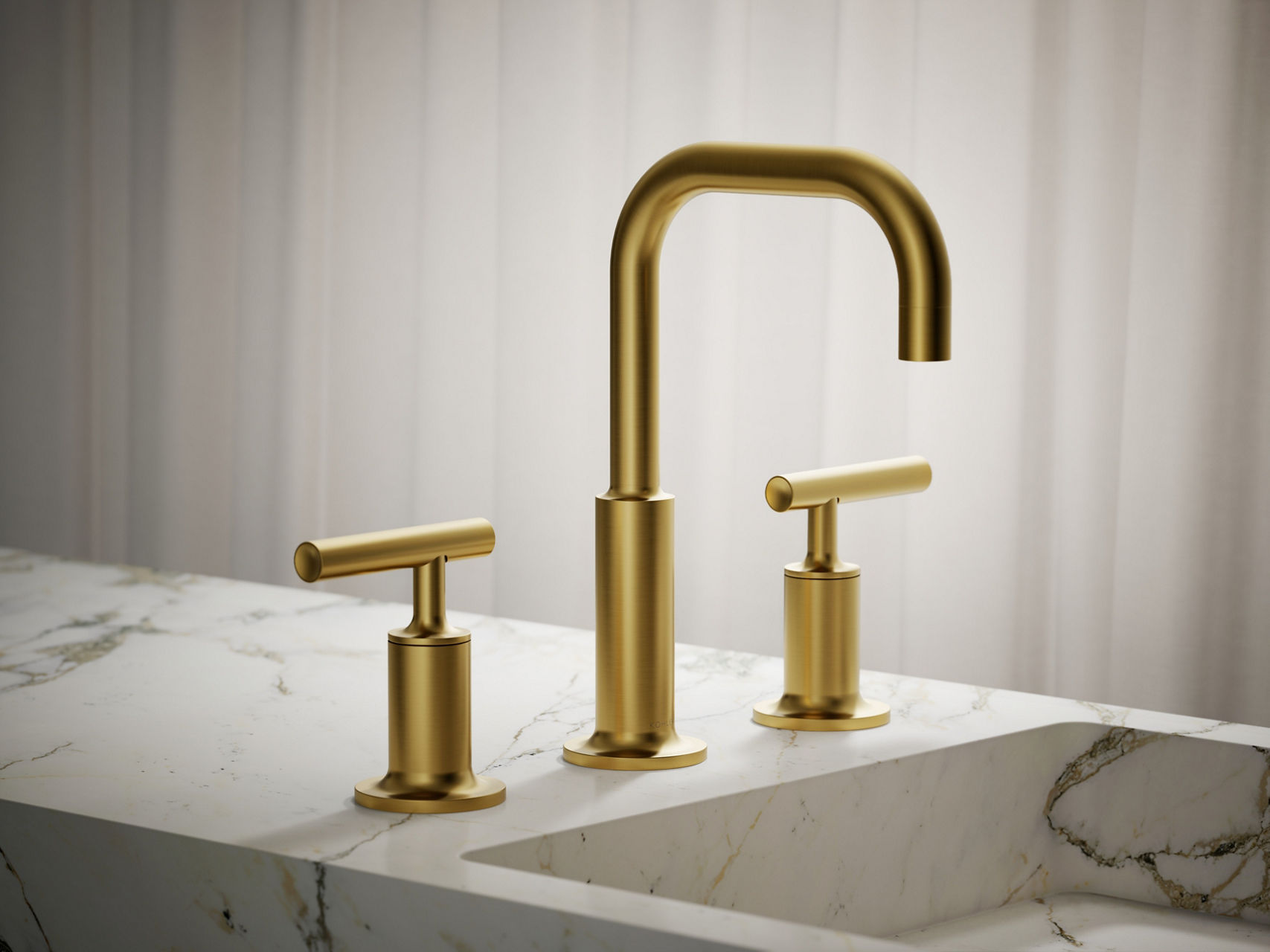 Modern brushed gold three-hole faucet set with tall arched spout and dual handles on marble countertop.